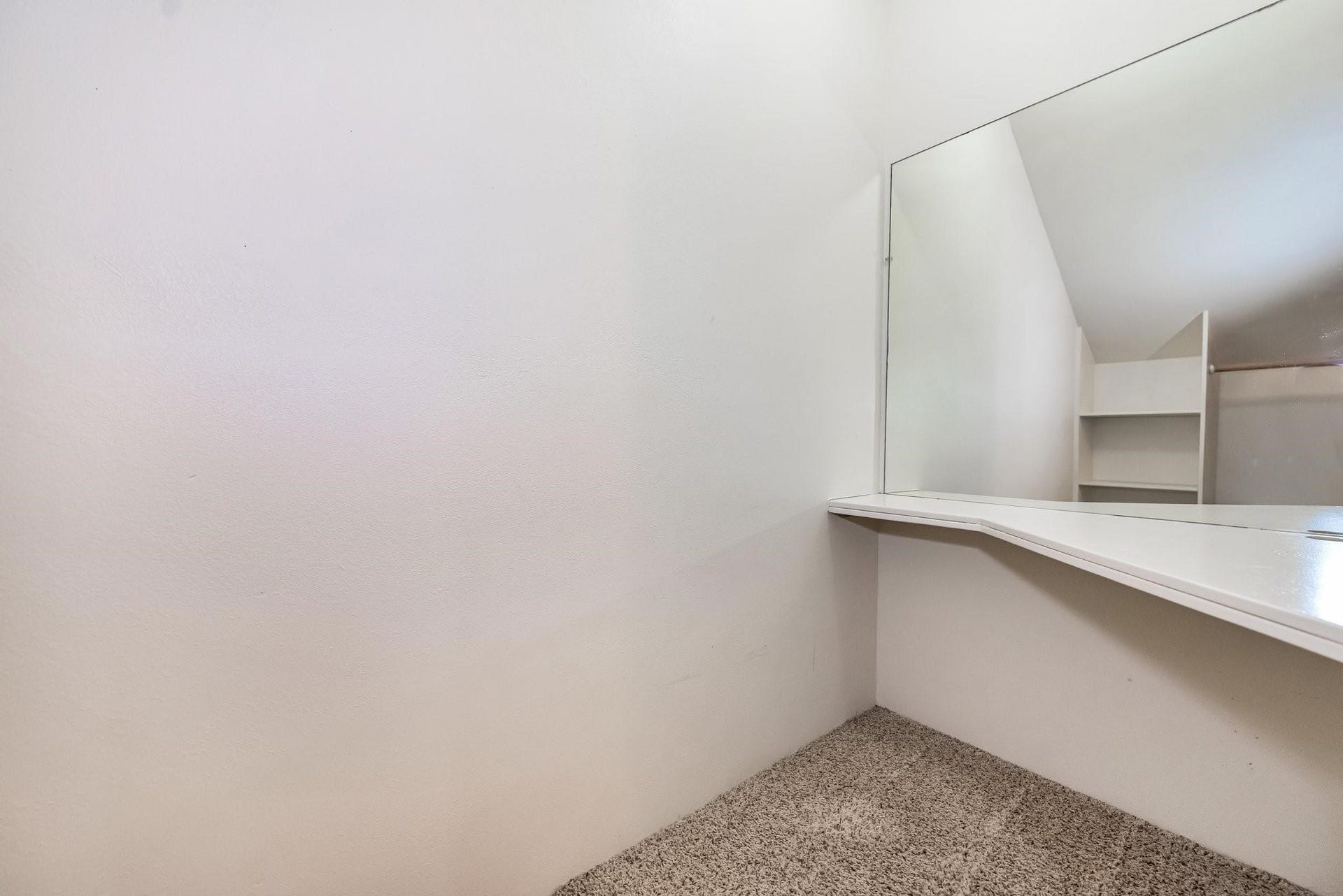 42 S Peaceful Canyon Circle, The Woodlands, TX 77381 Third bedroom closet with built-in desk that could be used as a study space or a princess dressing area.