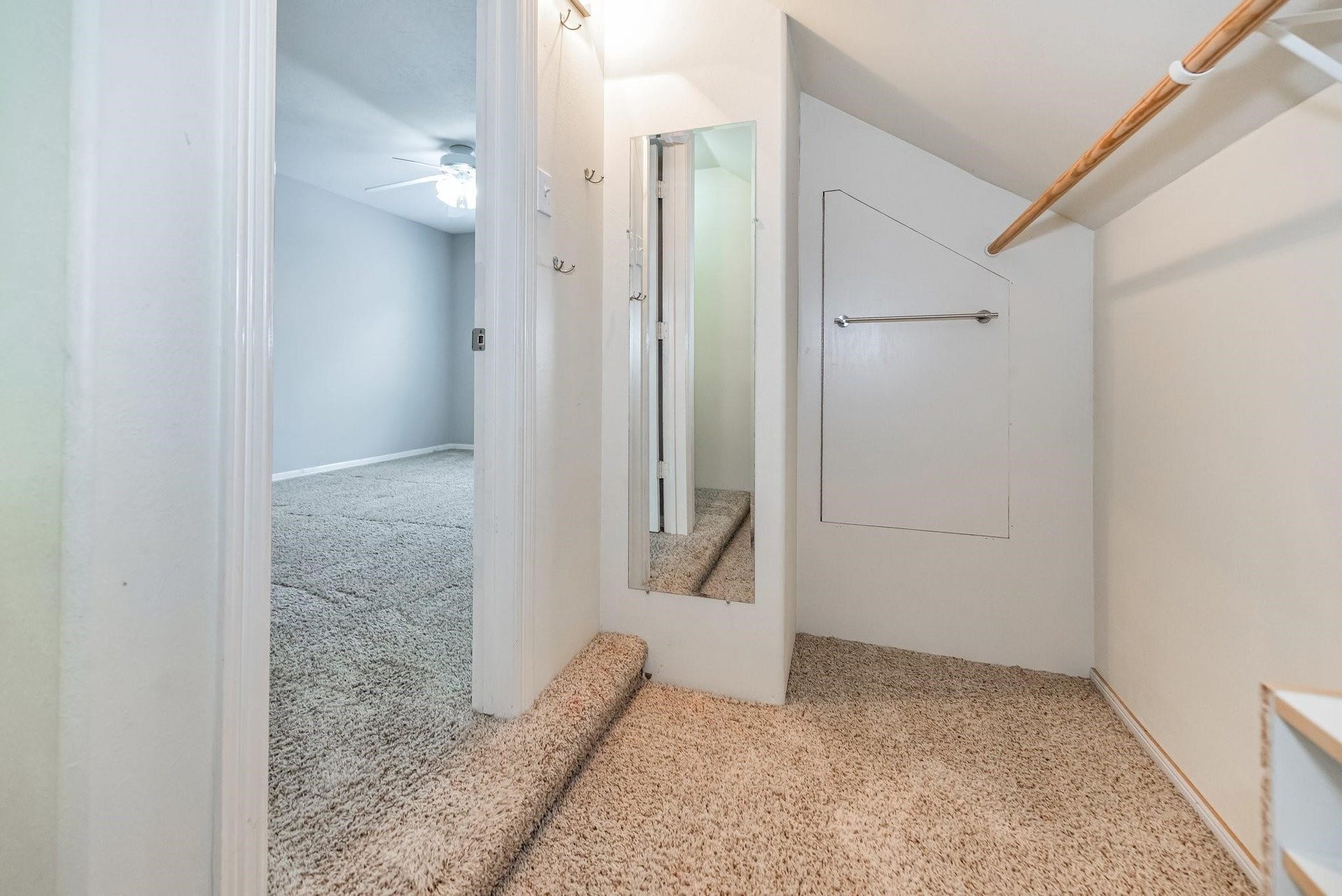 42 S Peaceful Canyon Circle, The Woodlands, TX 77381 Third bedroom closet with dressing mirror and access to attic storage.