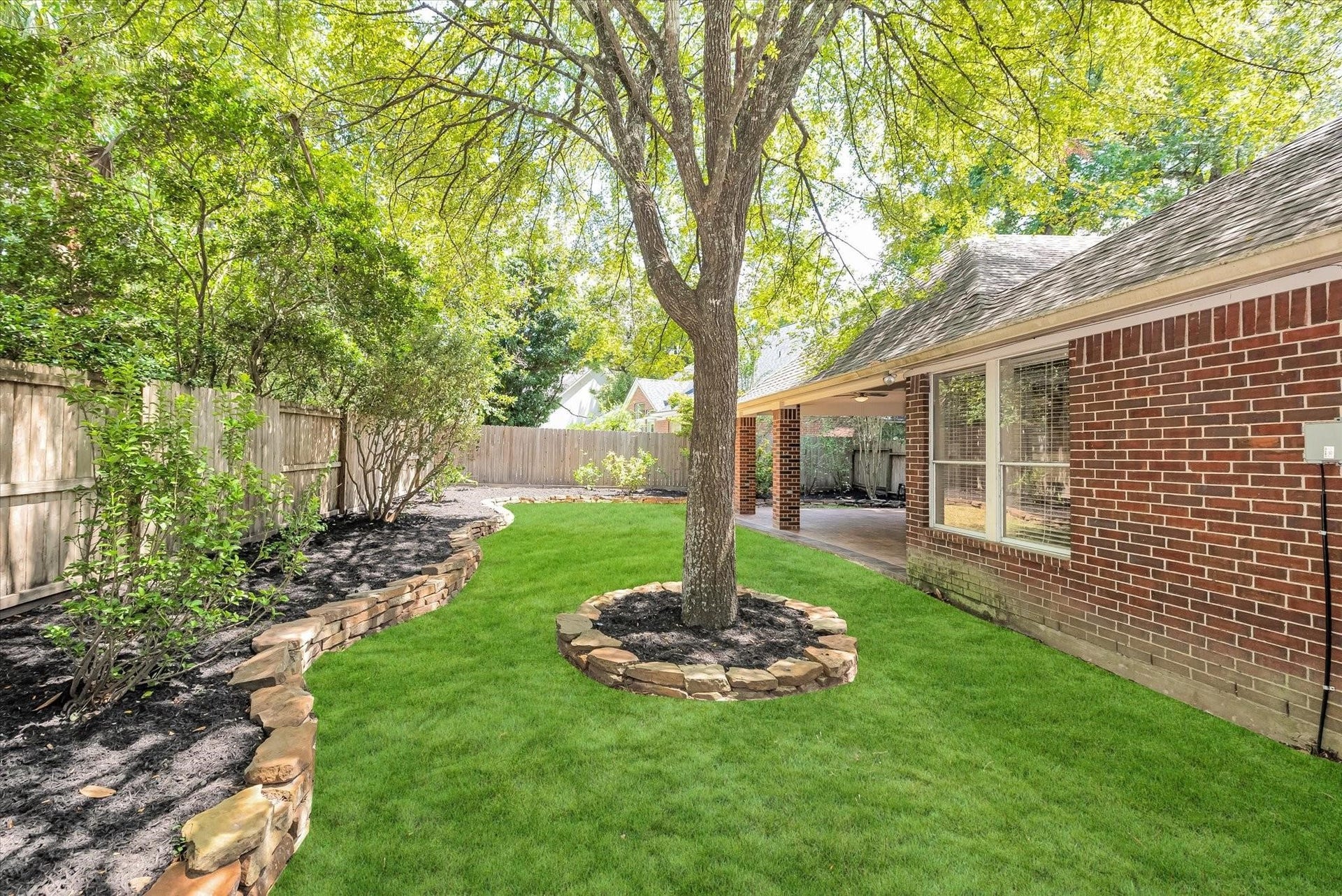 42 S Peaceful Canyon Circle, The Woodlands, TX 77381 Private and peaceful ample backyard with freshly manicured landscaping and soaring trees.