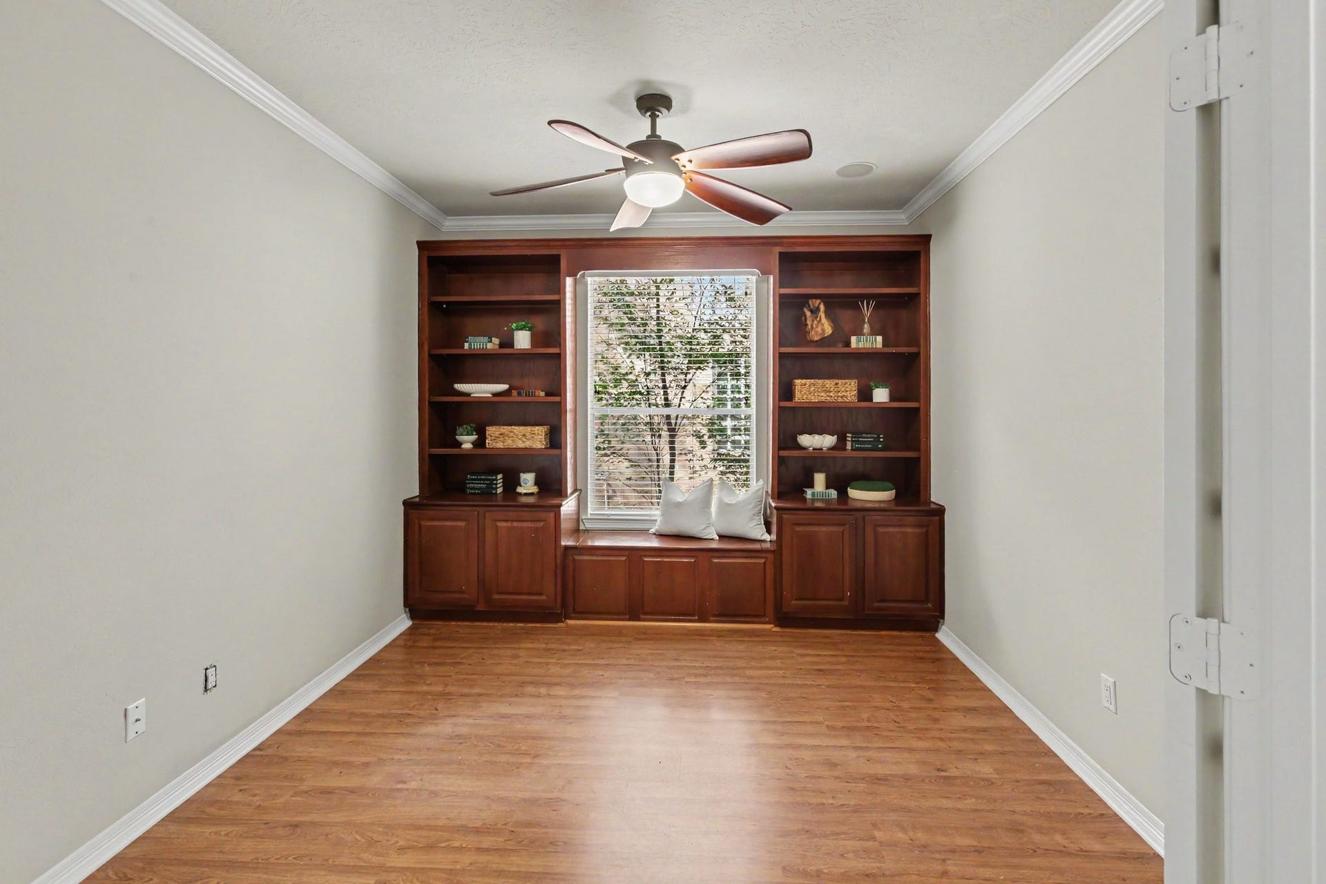 42 S Peaceful Canyon Circle, The Woodlands, TX 77381 The study with built-in shelves and a storage bench perfect for reading. The double french doors (not shown), close off the study for complete privacy.