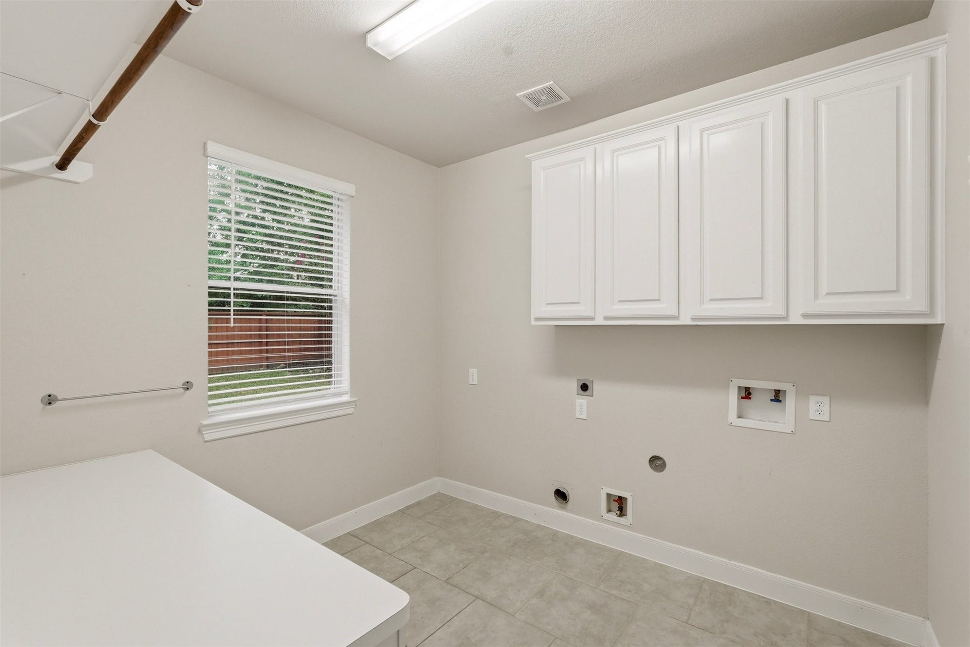 18034 Crescent Royale Way, Humble, TX 77346 Laundry room with built-in folding table