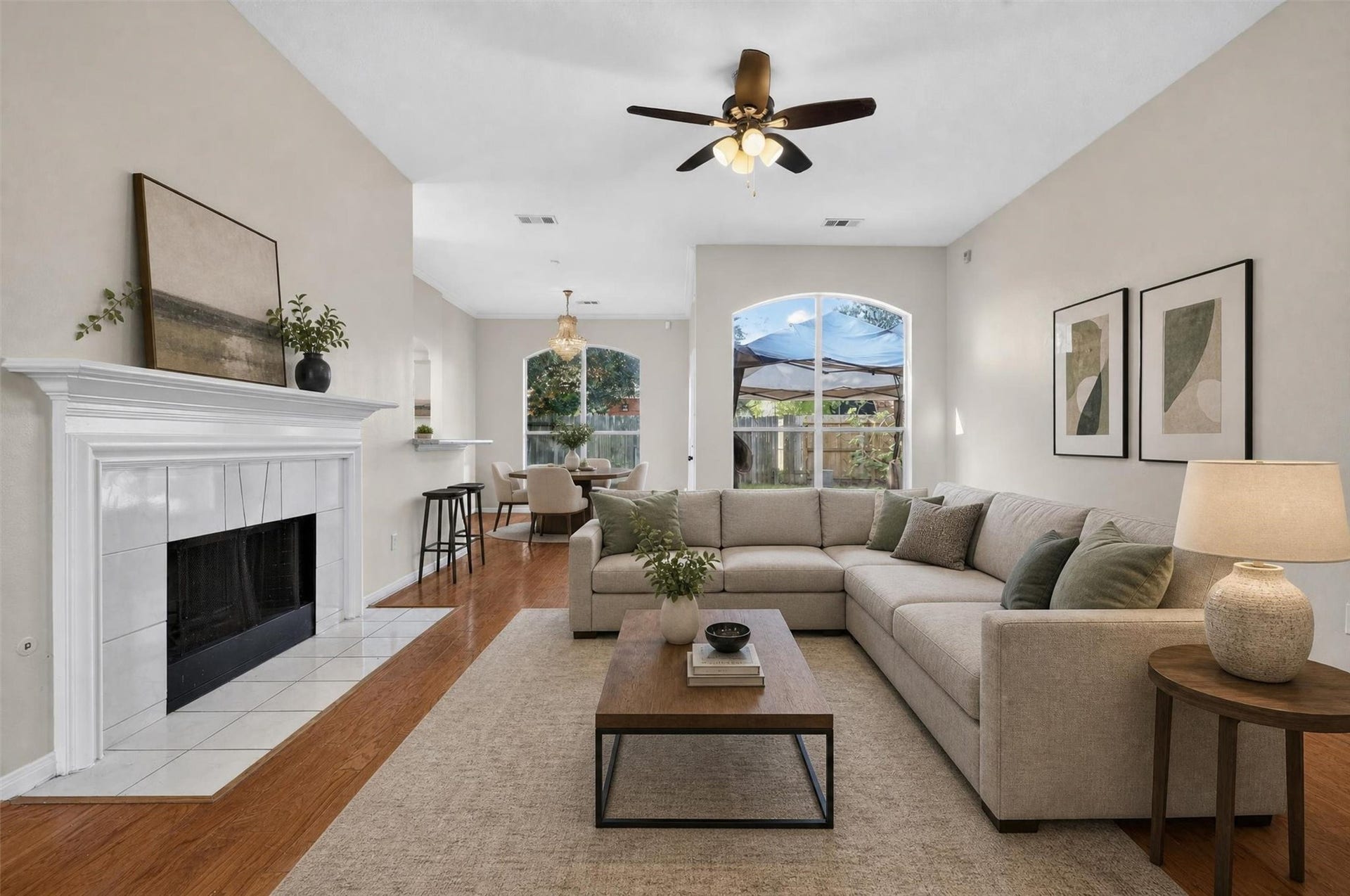 15627 Rosewood Hill Court, Sugar Land, TX 77498 Virtually staged living room surrounded by the cozy fireplace