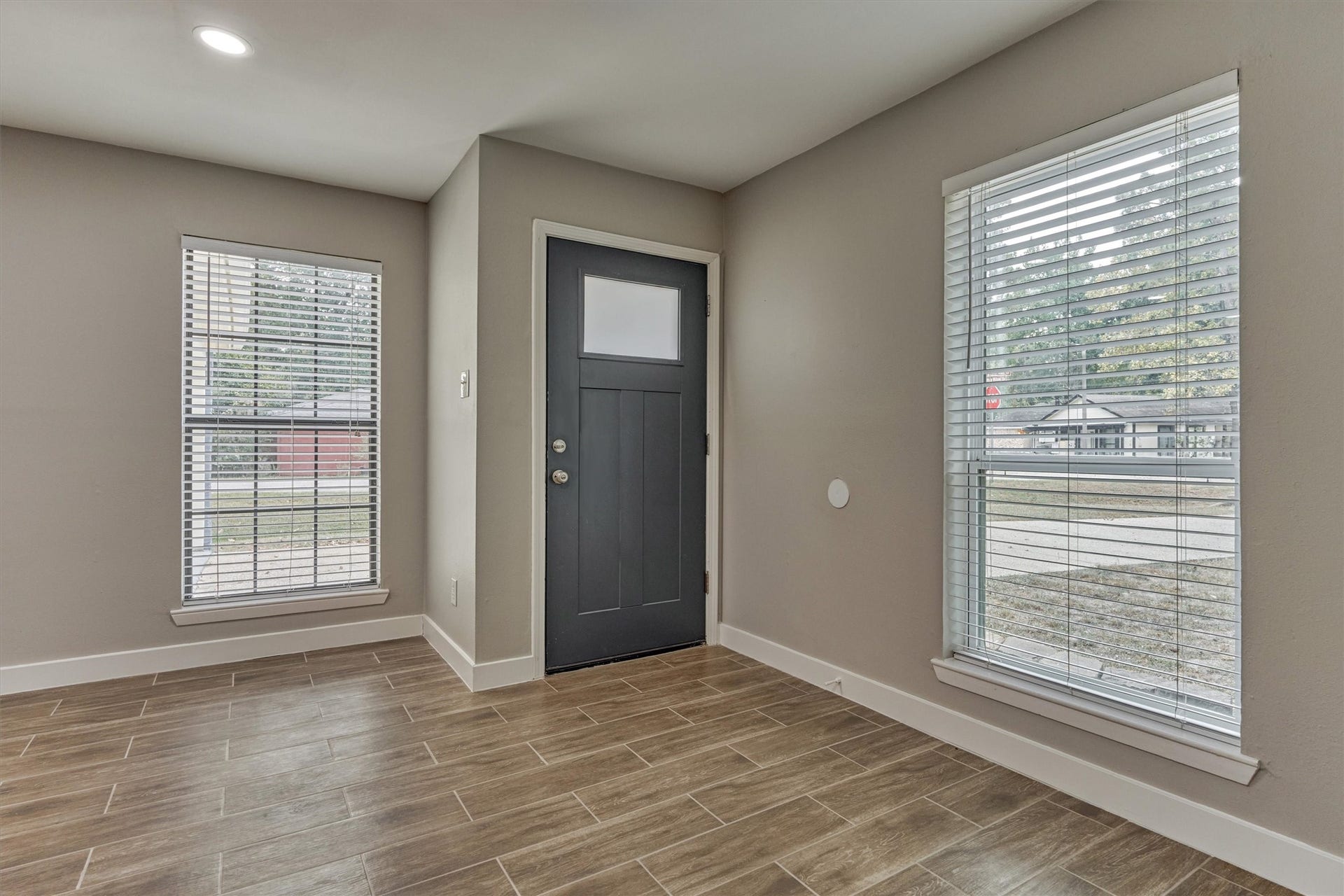 88 W White Willow Circle, The Woodlands, TX 77381 View of the upgraded ront door and windows overlooing the front yard.