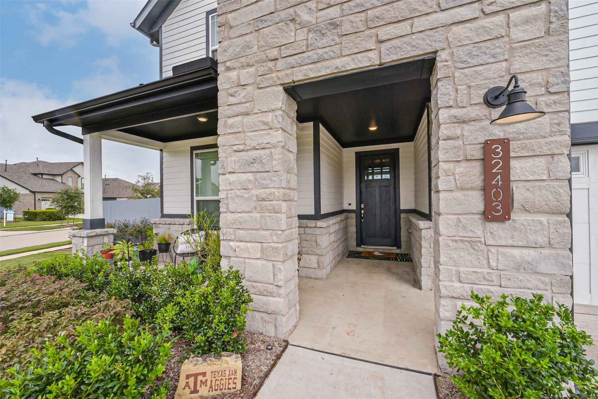 32403 Clouser Crawdad Court, Fulshear, TX 77441 Beautiful stone entry.