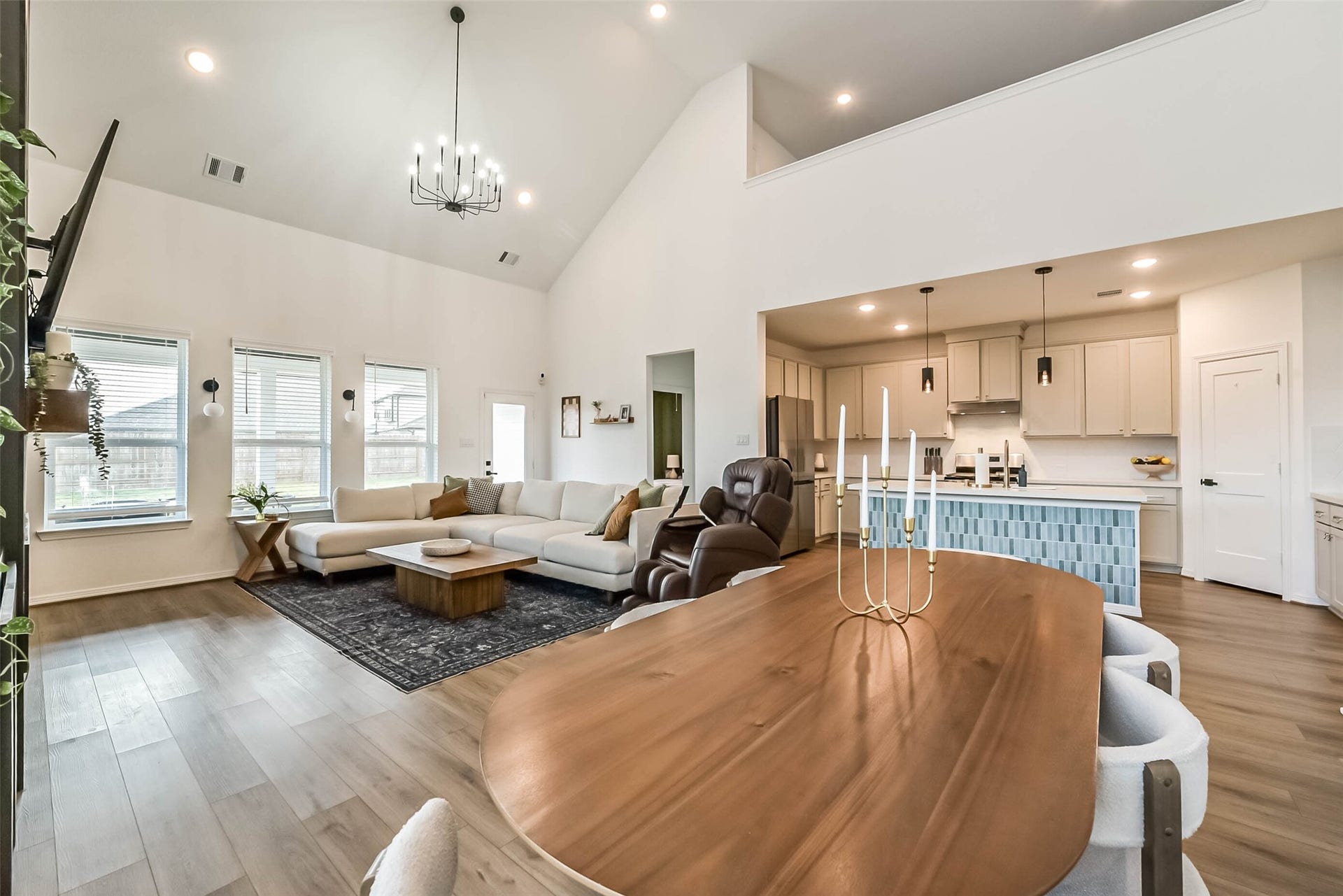 32403 Clouser Crawdad Court, Fulshear, TX 77441 The living room is open to the dining room and kitchen.