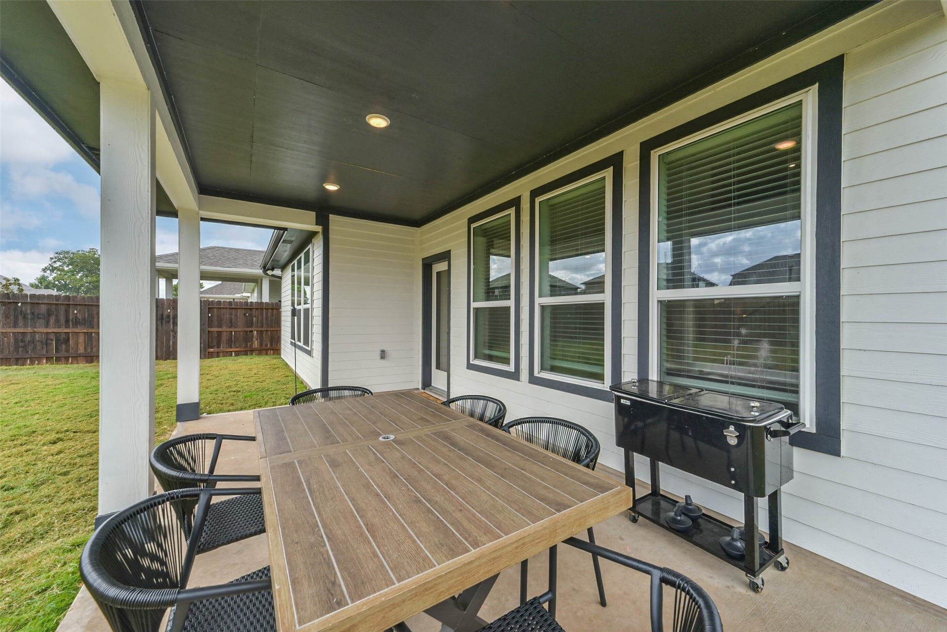 32403 Clouser Crawdad Court, Fulshear, TX 77441 The backyard is accessible through the living room, enjoy a fully covered patio.