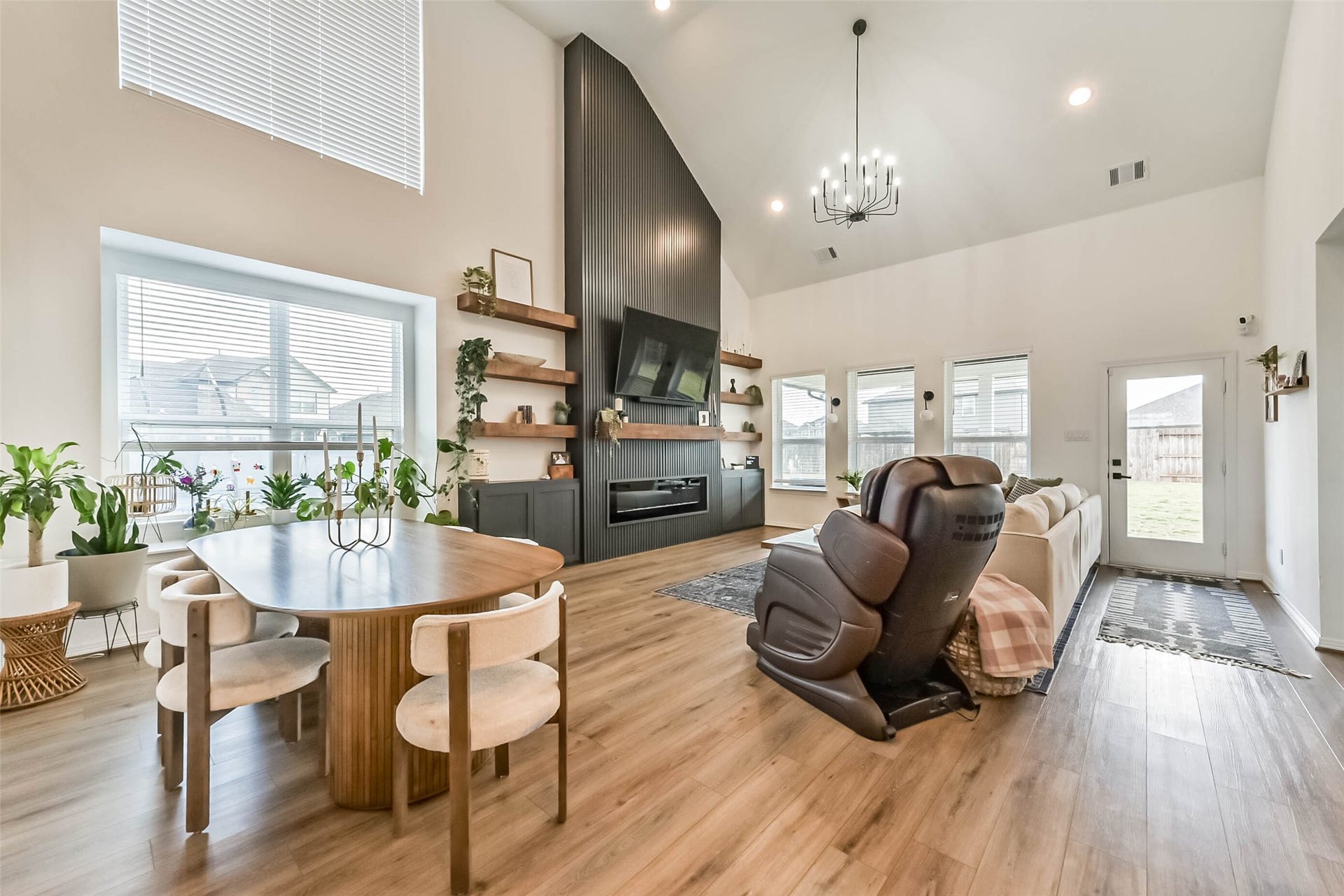 32403 Clouser Crawdad Court, Fulshear, TX 77441 Grand living room with tall ceilings and a custom, built in fireplace.