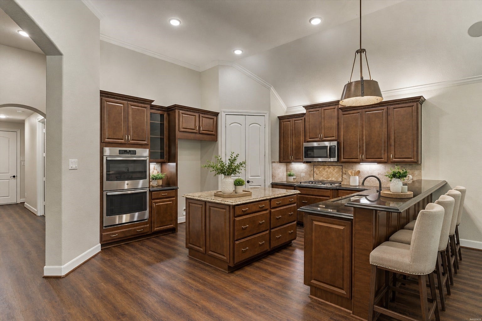 11 S Sandbells Park Lane, Montgomery, TX 77316 *This is a virtually staged photo* The chef of the family will love the double ovens, center island, and gas cooktop.