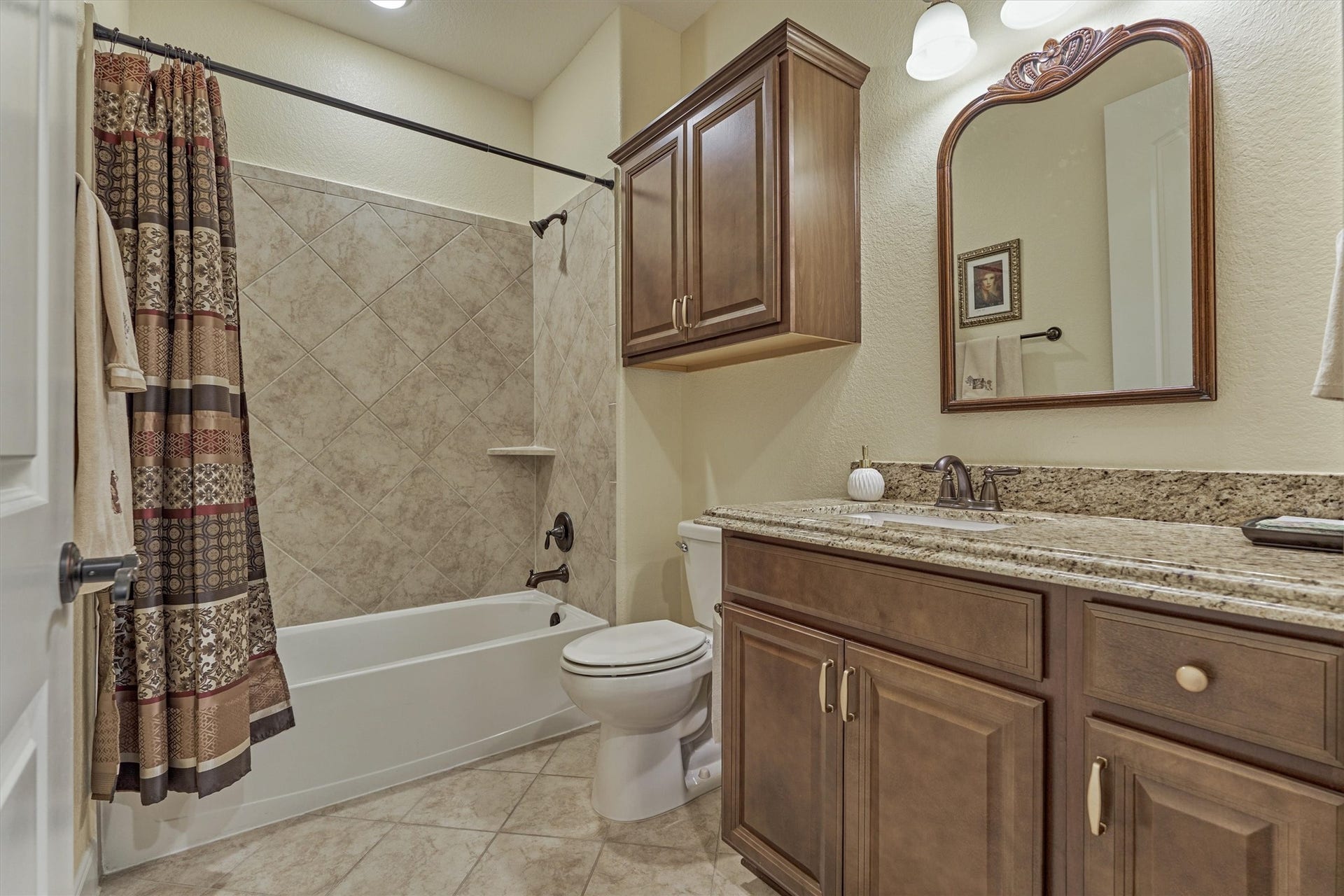 11 S Sandbells Park Lane, Montgomery, TX 77316 Full bathroom with tub/shower combo for secondary bedroom #1.