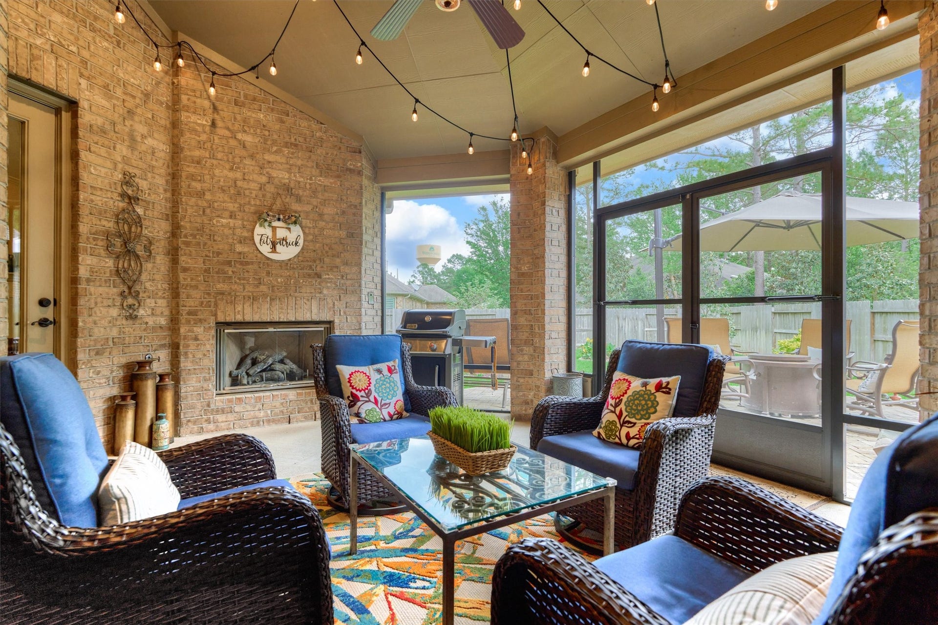 11 S Sandbells Park Lane, Montgomery, TX 77316 Savor a shady retreat with fireplace and serene patio views of the tranquil backyard retreat.