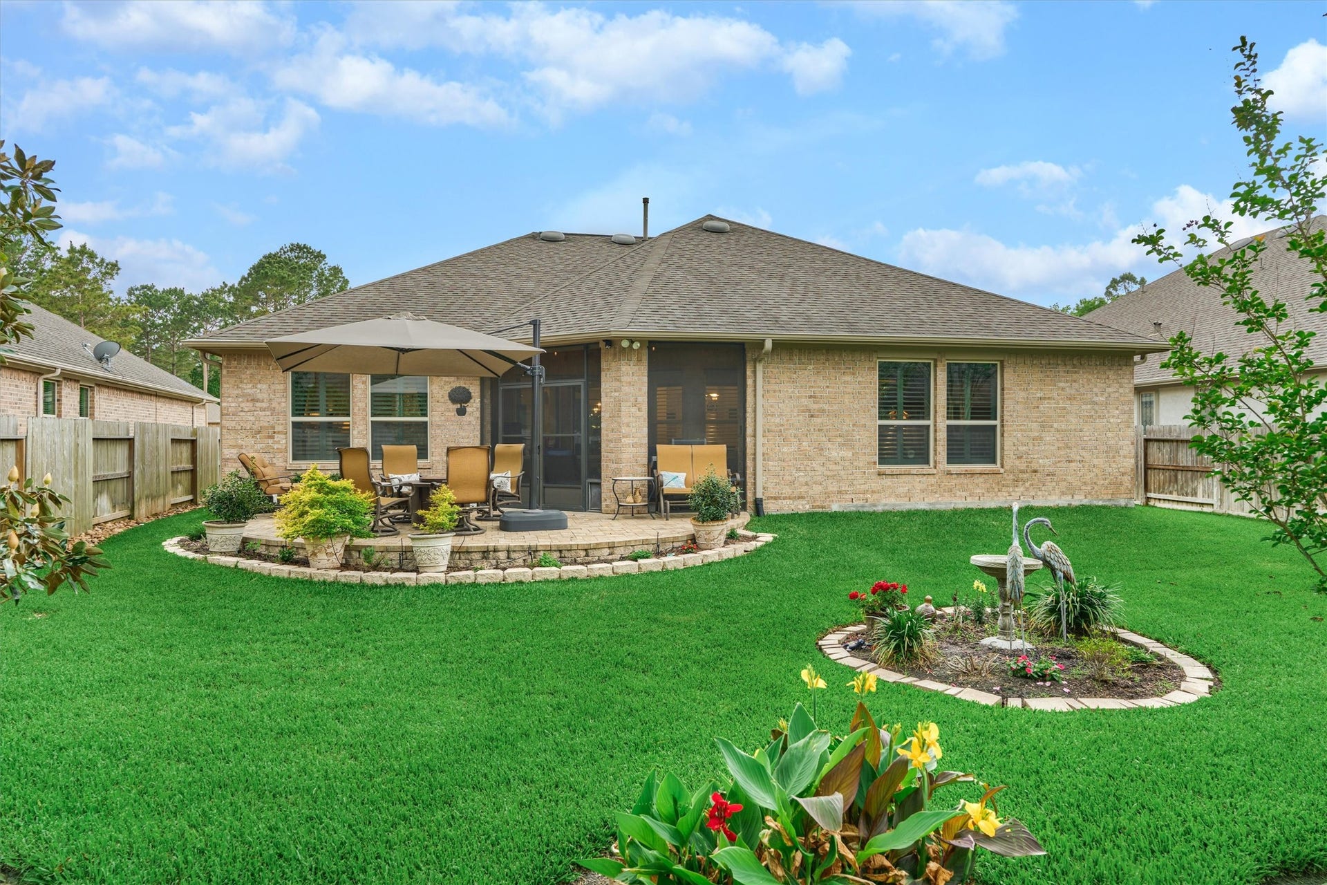 11 S Sandbells Park Lane, Montgomery, TX 77316 Vibrant landscaping makes this exquisite backyard oasis the ultimate peaceful retreat!