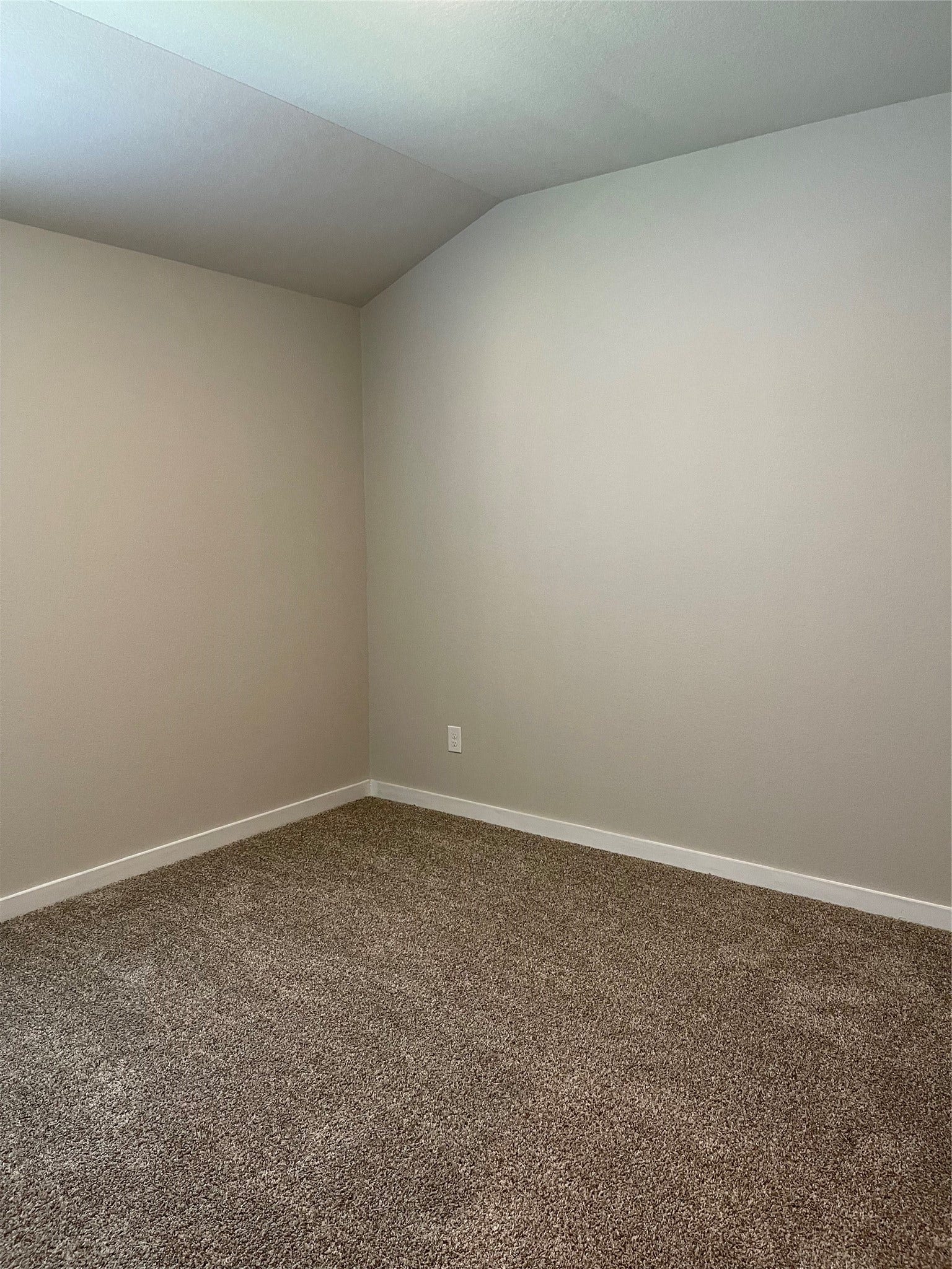 12285 Council Grove Drive, Conroe, TX 77384 Cozy room with soft carpet flooring and neutral walls, perfect for personalization.