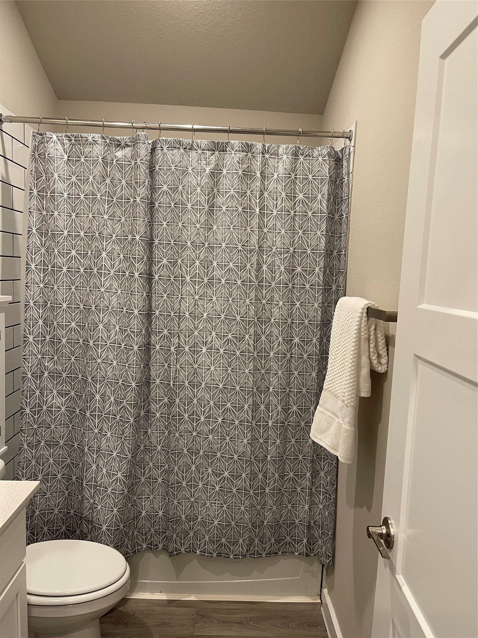12285 Council Grove Drive, Conroe, TX 77384 Cozy bathroom featuring modern sleek white cabinetry, creating a clean and inviting space.