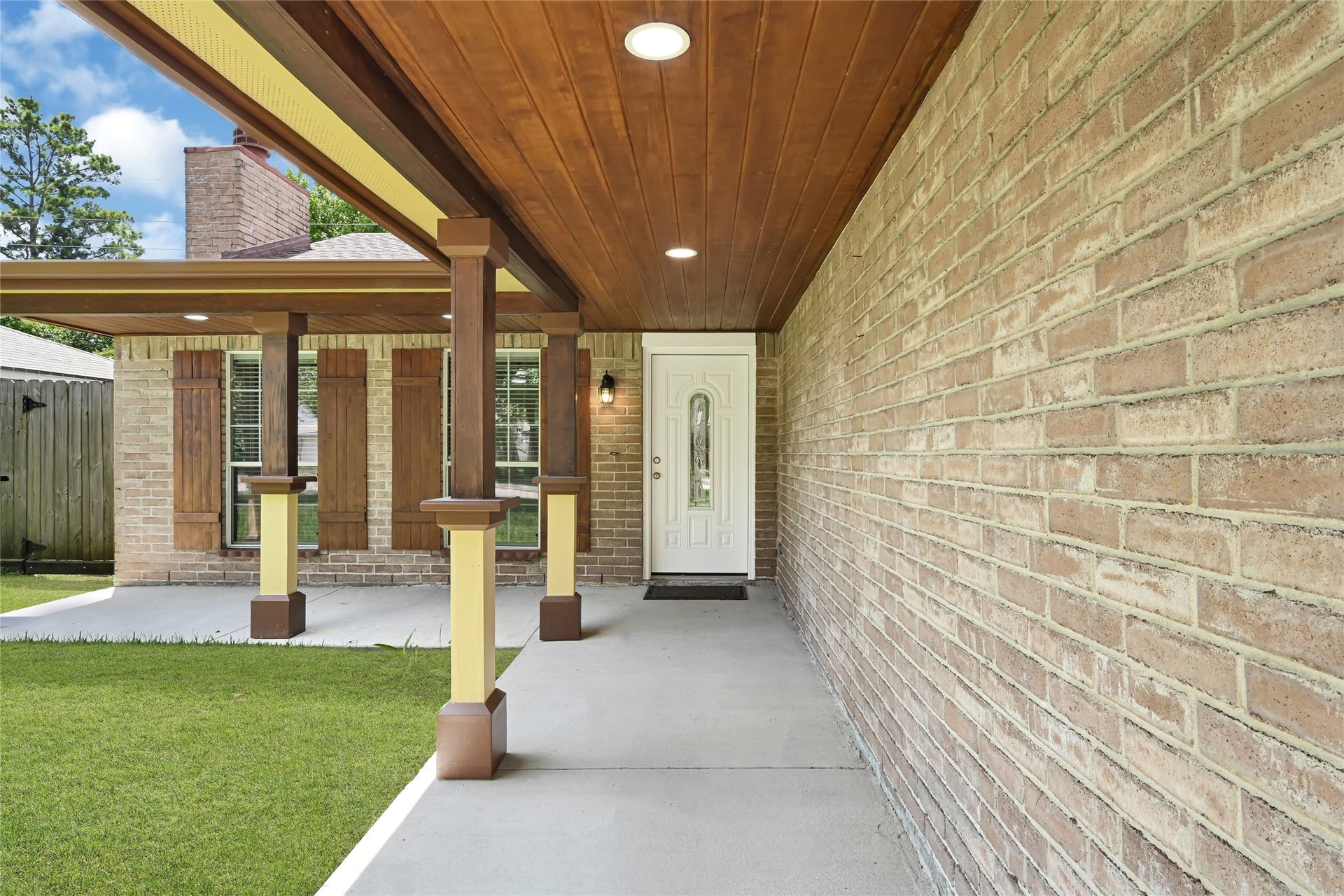 Stunning custom front covered patio.