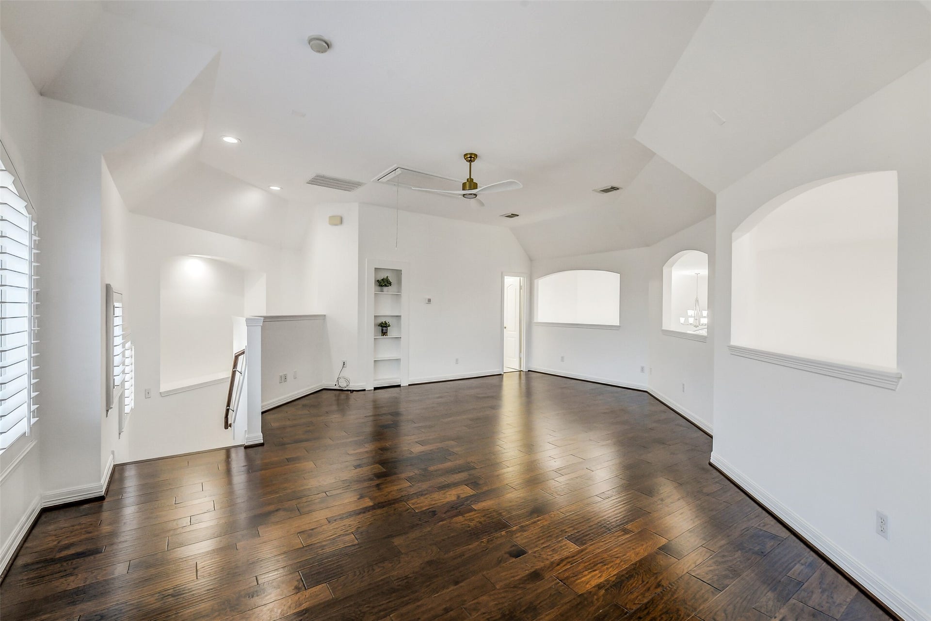 21018 W Farwood Terrace, Cypress, TX 77433 Upstairs game room accessed from kitchen stairs. Full bathroom and large climate controlled hidden room behind shelving.
