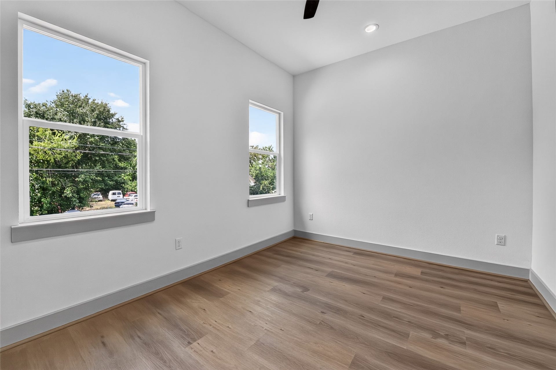 6815 Stearns Street, Houston, TX 77021 Featuring two expansive windows, this secondary bedroom maximizes light and space effortlessly.