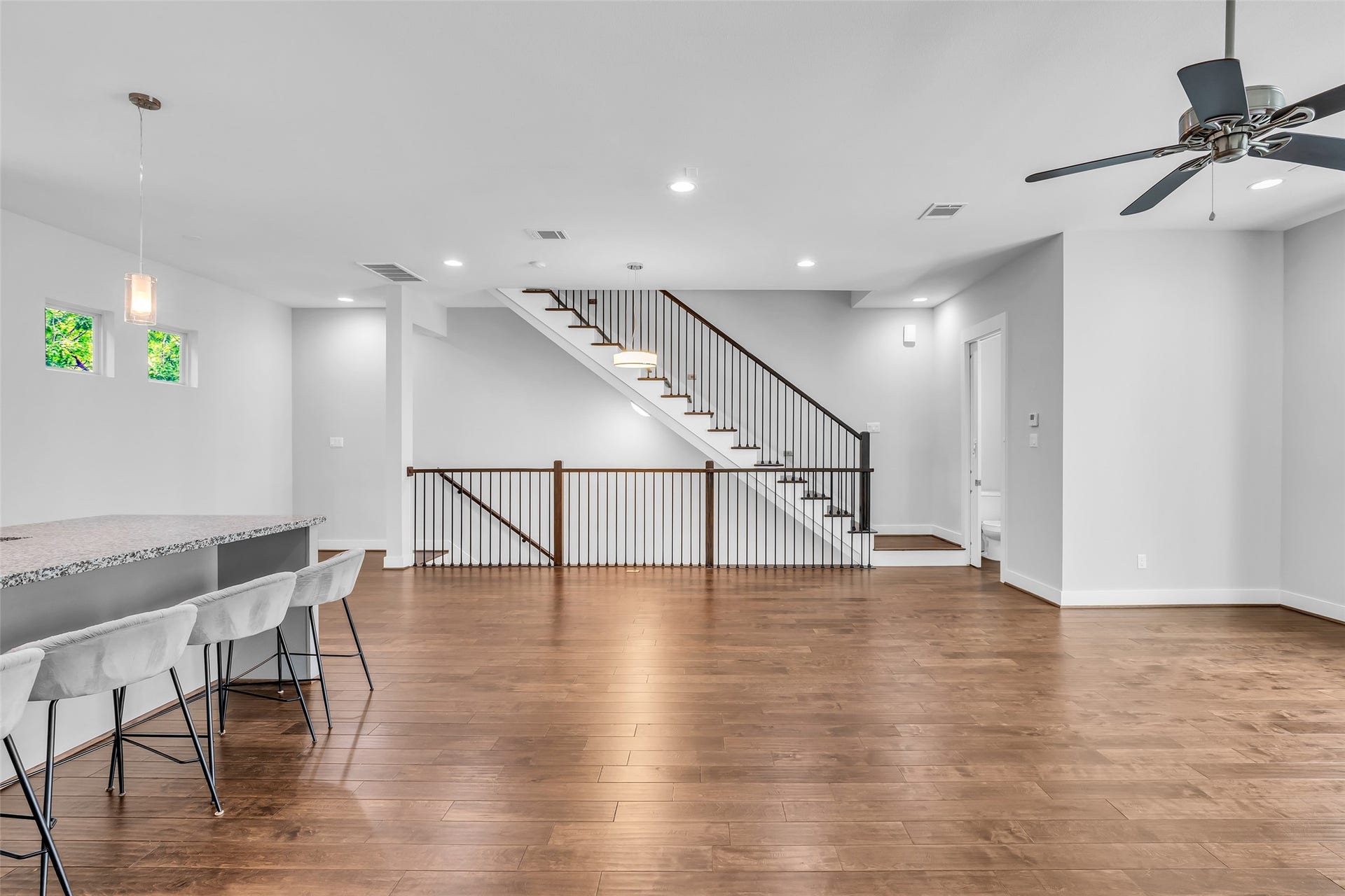 3309 Jefferson Street, #C, Houston, TX 77003 Alternate angle of the living room showcasing its open layout and a half bathroom located at the corner.