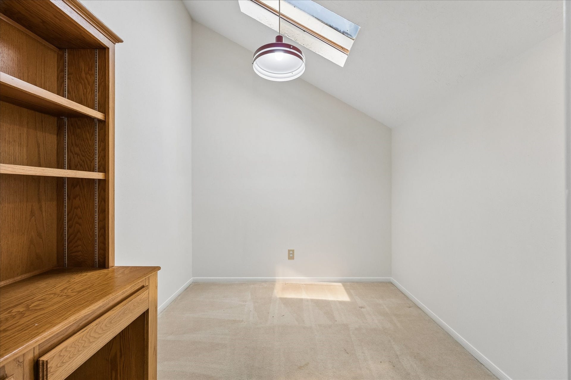 3806 Crystal Falls Drive, Missouri City, TX 77459 Bonus flex space in the upstairs bedroom with built-in cabinetry and a skylightideal for a home office, study, craft room, hobby space, or additional storage.