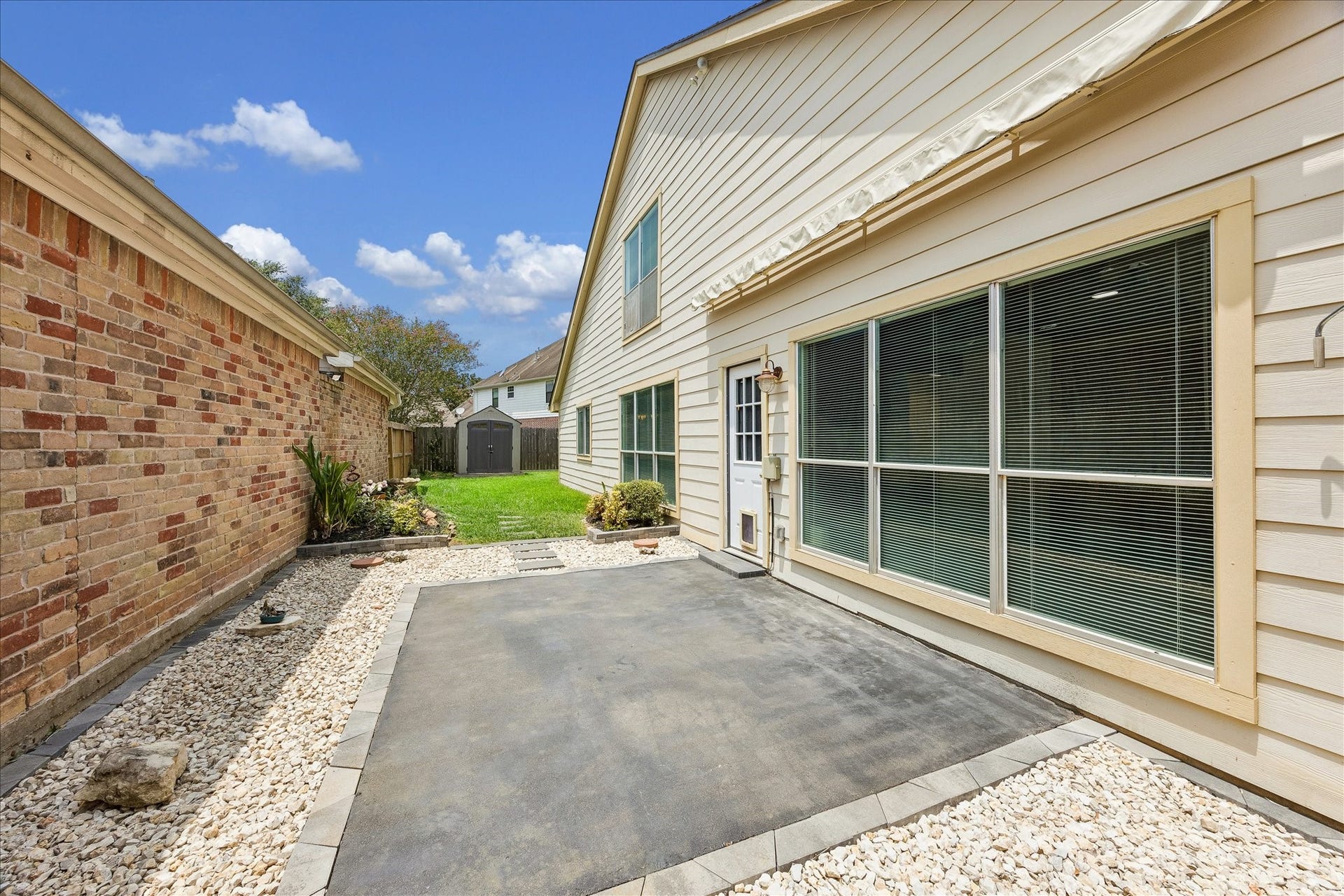 3806 Crystal Falls Drive, Missouri City, TX 77459 Spacious patio extends the homes living space outdoors with convenient access to the backyard