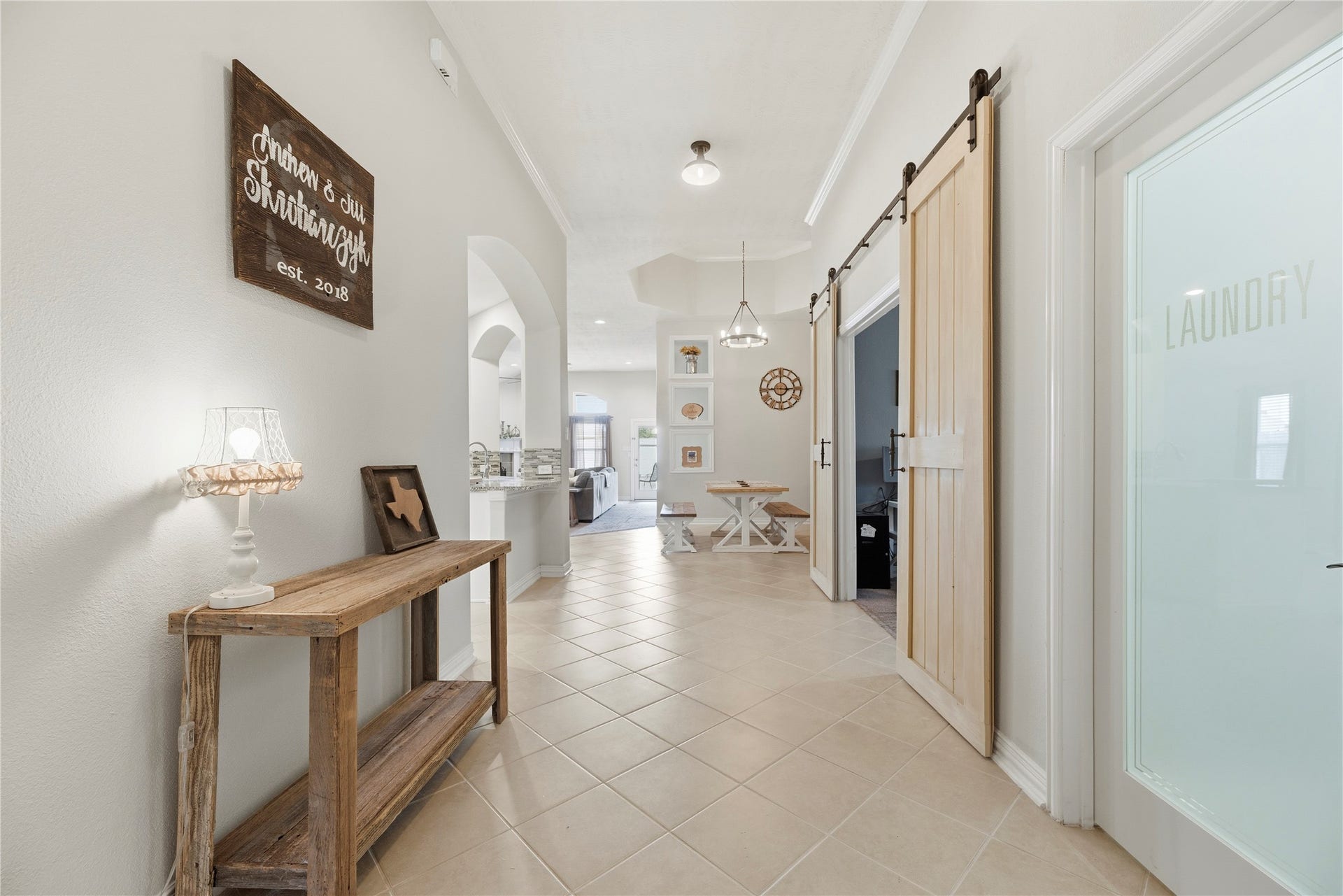16014 Mark Crest Drive, Hockley, TX 77447 Tile flooring, high ceiling, crown molding and neutral paint upon entry.