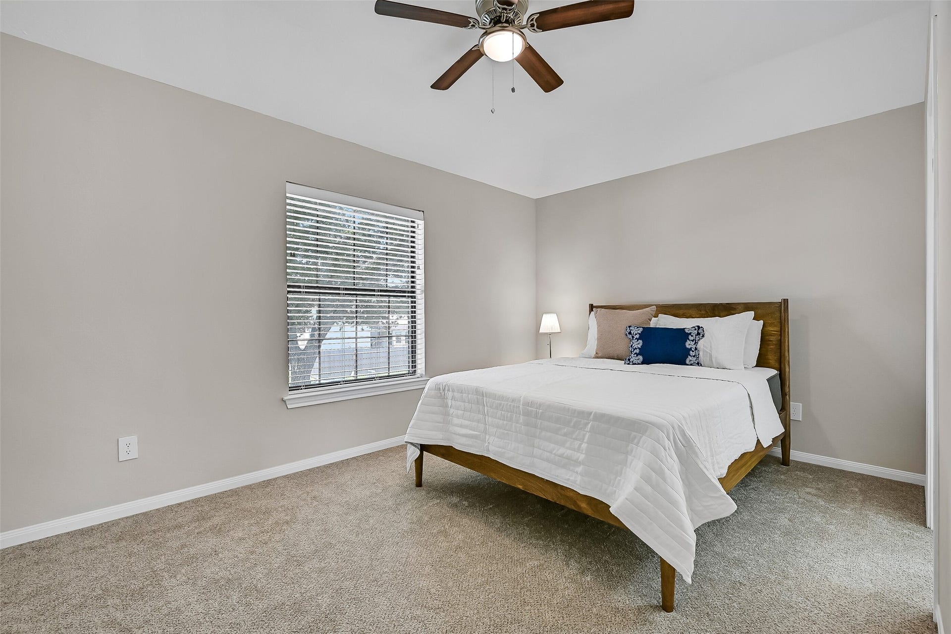 2505 Sarasota Drive, Friendswood, TX 77546 One of three secondary bedrooms upstairs, this spacious room offers neutral carpet, a ceiling fan, abundant natural light, & a convenient Jack & jill style bathroom. Each secondary bedroom also features its own walk-in closet.