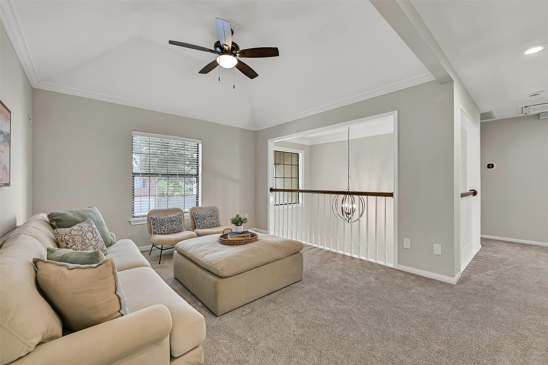 2505 Sarasota Drive, Friendswood, TX 77546 The upstairs gameroom serves as a central gathering space connecting the secondary bedrooms and baths. Neutral carpet, a tray ceiling and an open railing overlooking the foyer help the second floor feel bright, spacious and connected.
