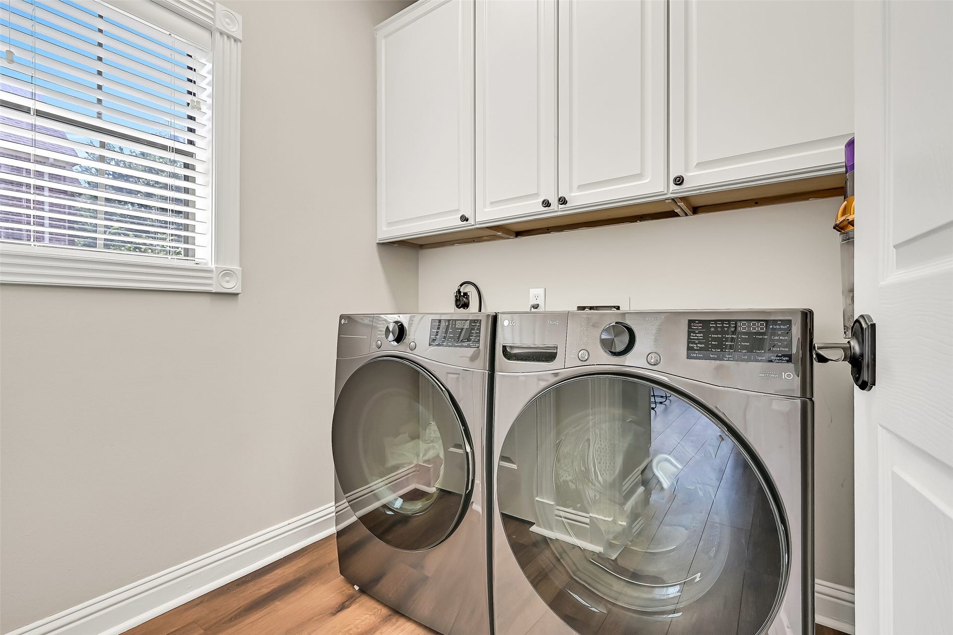 2505 Sarasota Drive, Friendswood, TX 77546 The dedicated utility room offers upper cabinetry for convenient storage, space for full-size appliances and a window for natural light. Its separate location keeps laundry neatly tucked away from the homes primary living and entertaining spaces.