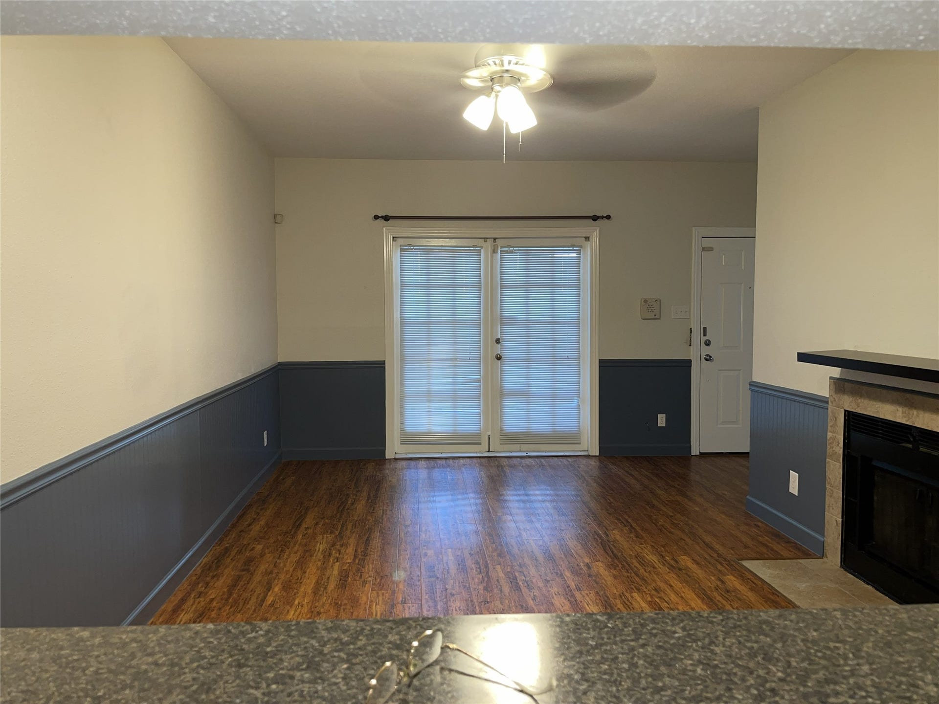 2121 El Paseo Street, #1511, Houston, TX 77054 The living area offers a view of the French doors, highlighting the rooms layout and providing a blank canvas for your own furnishings and personal style.