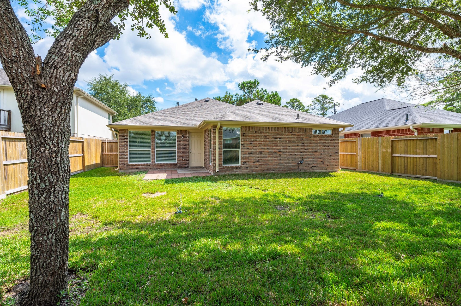 4337 Country Club Drive, Dickinson, TX 77539 Back of the property. Home is bricked on all 4 sides.