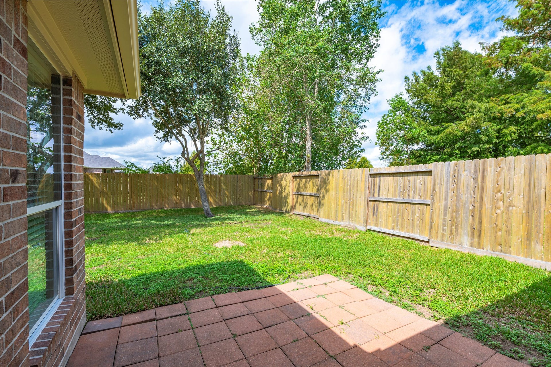 4337 Country Club Drive, Dickinson, TX 77539 Brick back patio area and large backyard.