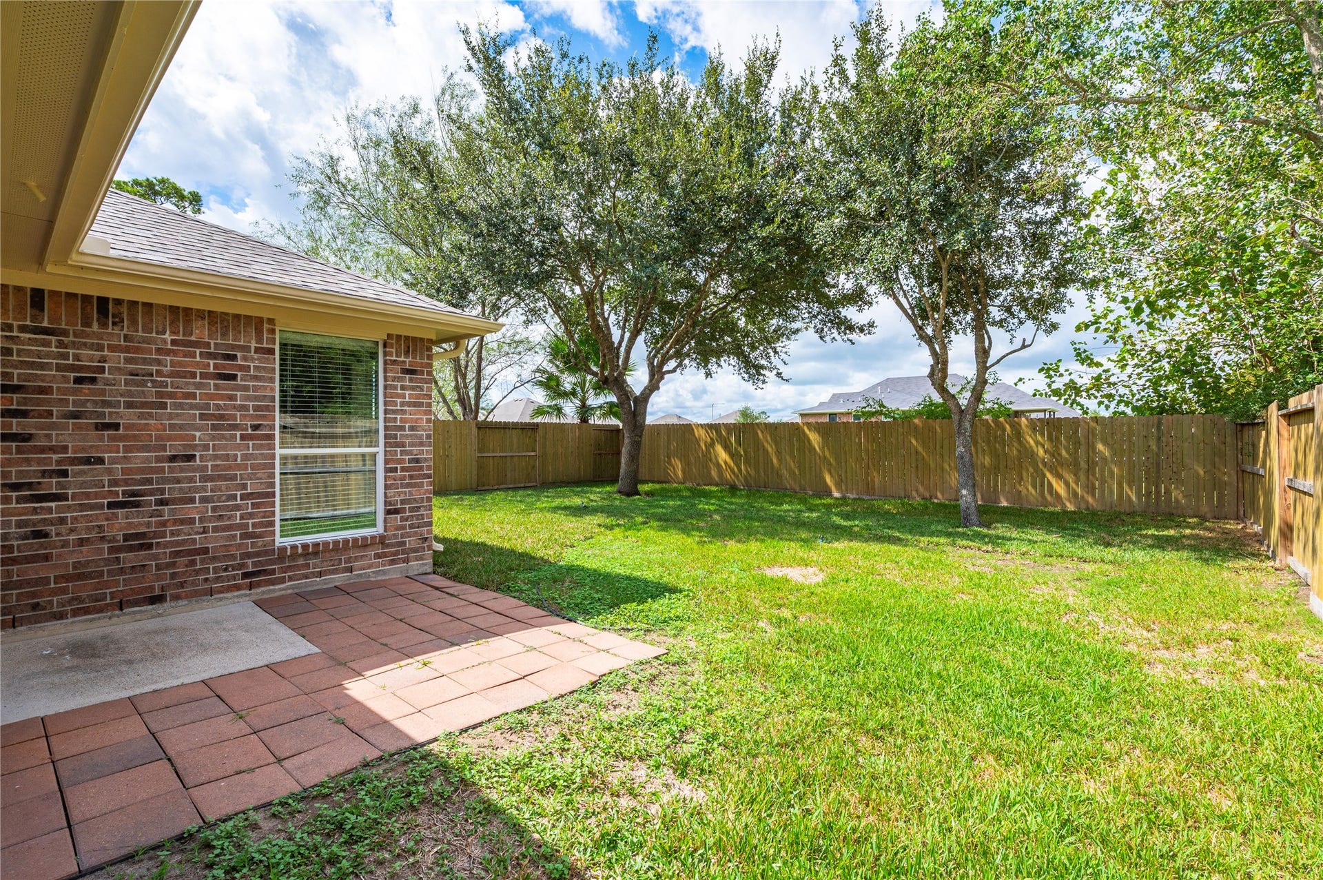 4337 Country Club Drive, Dickinson, TX 77539 View of the back patio area and backyard.