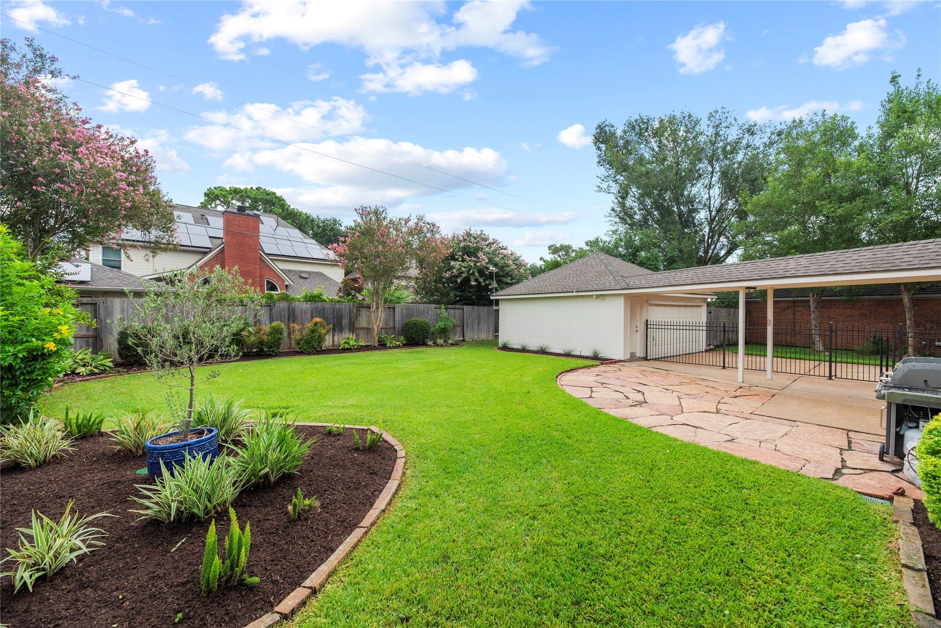 7426 Foxton Place Court, Houston, TX 77095 The expansive flagstone patio surrounded by mature landscaping creates an incredible setting for weekend cookouts, outdoor dining and evenings spent relaxing with friends under the open sky. This yard is fully equipped with an automatic sprinkler system and French drains.