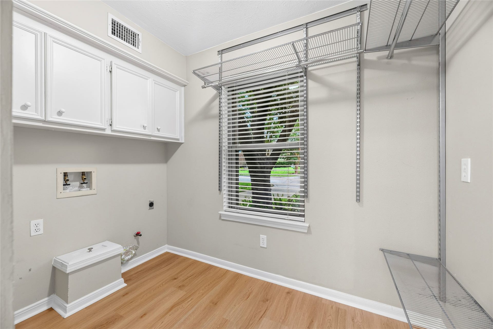 7426 Foxton Place Court, Houston, TX 77095 Conveniently located just off the kitchen, the utility room offers built-in cabinetry, extensive shelving & plenty of extra storage, along with an updated window & updated flooring.