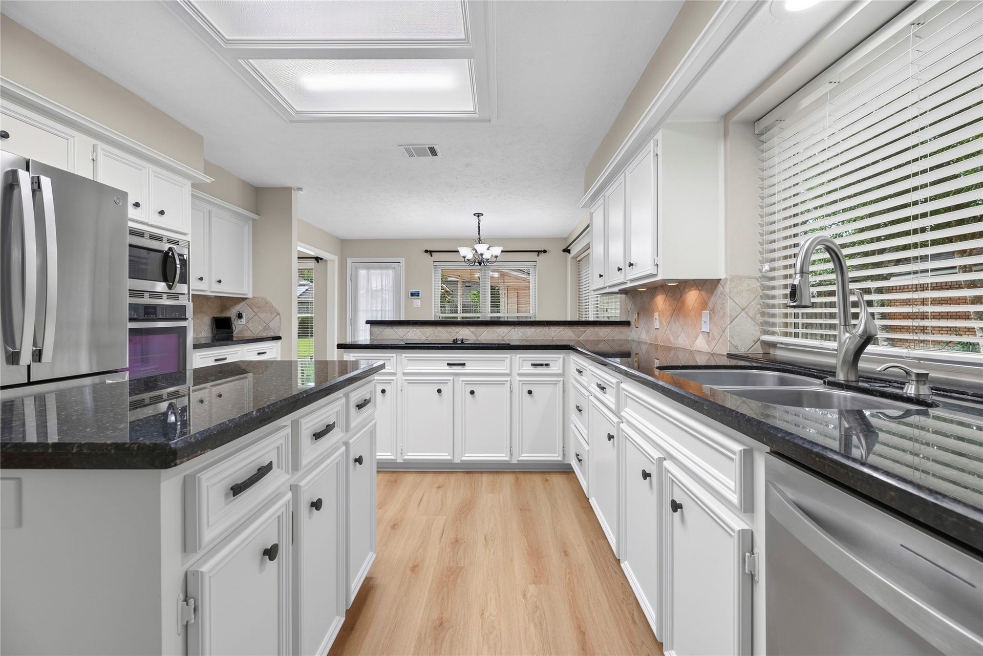 7426 Foxton Place Court, Houston, TX 77095 Ditch the takeout and enjoy home-cooked meals more often with the help of built-in stainless-steel appliances, plenty of counter space, abundant cabinet storage and a walk-in pantry that keeps everyday essentials close at hand.