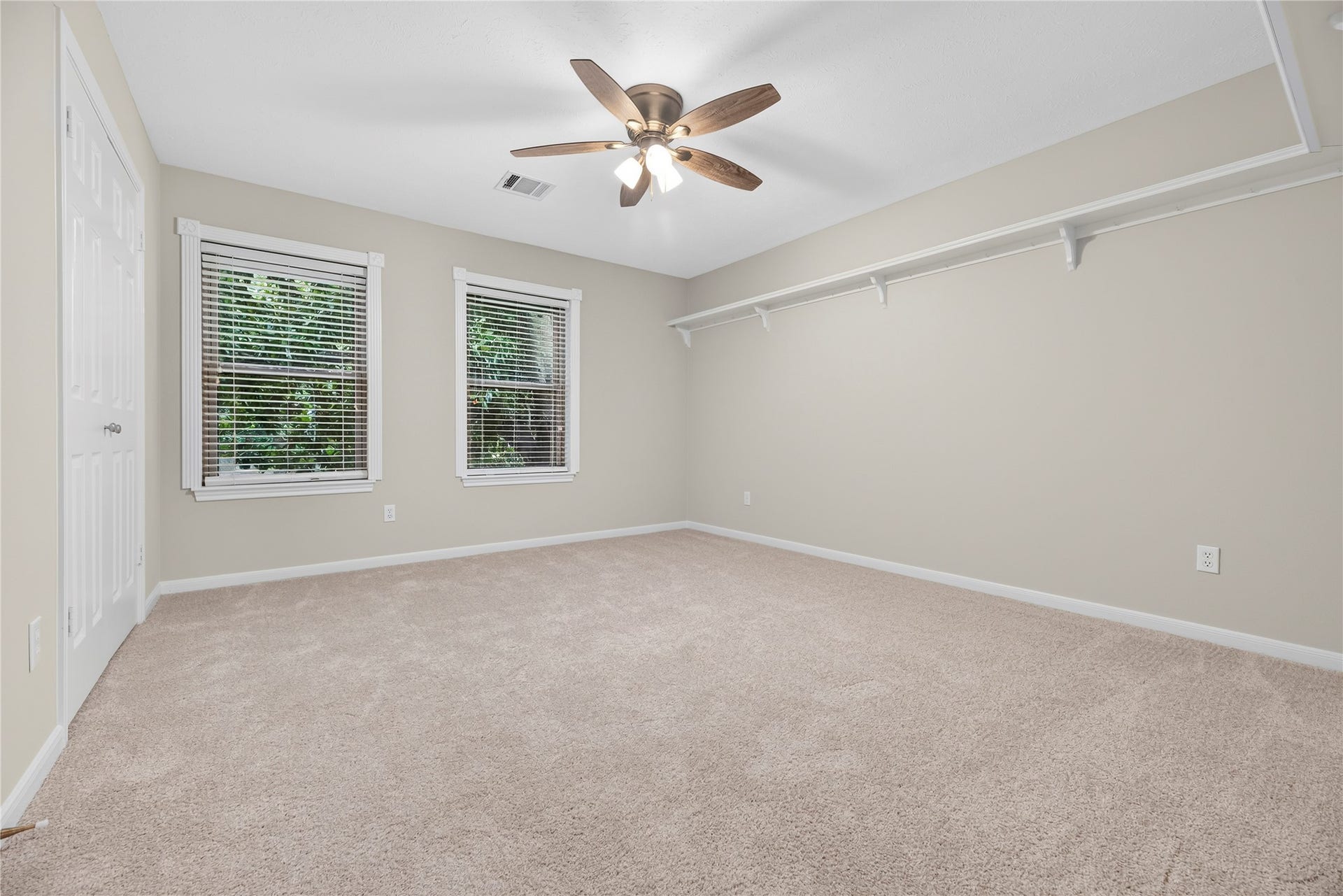 7426 Foxton Place Court, Houston, TX 77095 This inviting upstairs guest bedroom offers fresh paint and updated carpet (both in July 2026) & a large updated window that fills the space with natural light. Its a comfortable retreat for overnight guests. For added peace of mind, 3 combination smoke & carbon monoxide detectors were installed in Jan 2026 outside the bedroom areas.
