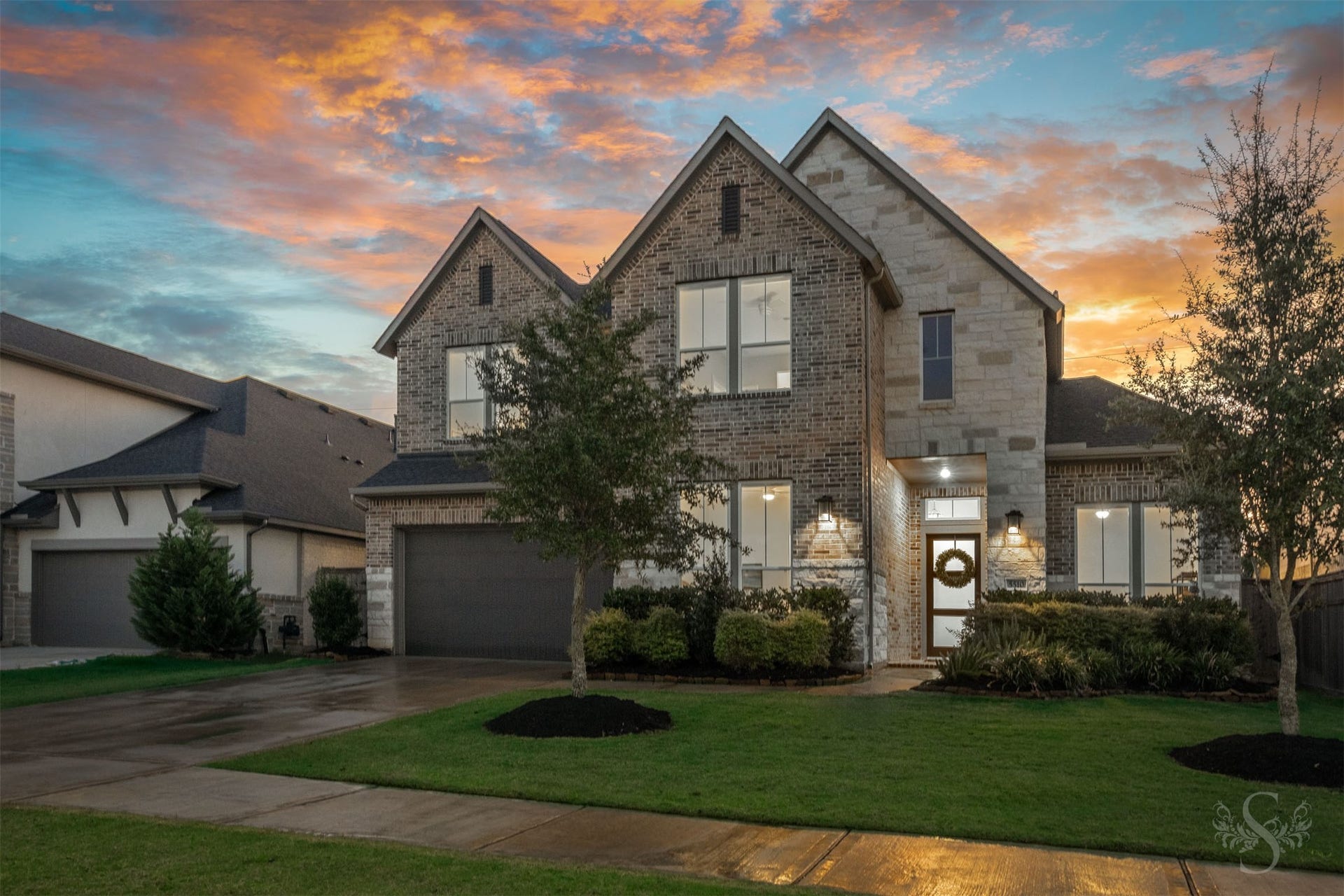 This exceptional 4 bedroom, 3.5 bath home in Cross Creek Ranch showcases striking brick and stone architecture with impressive curb appeal. A modern front door and manicured landscaping beautifully complete the exterior.