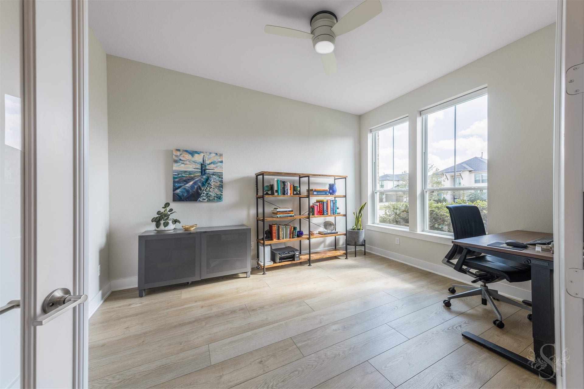 The private study offers an elegant work-from-home setting with space for a substantial desk and bookshelves. Expansive windows fill the room with natural light, while French doors provide privacy when needed.