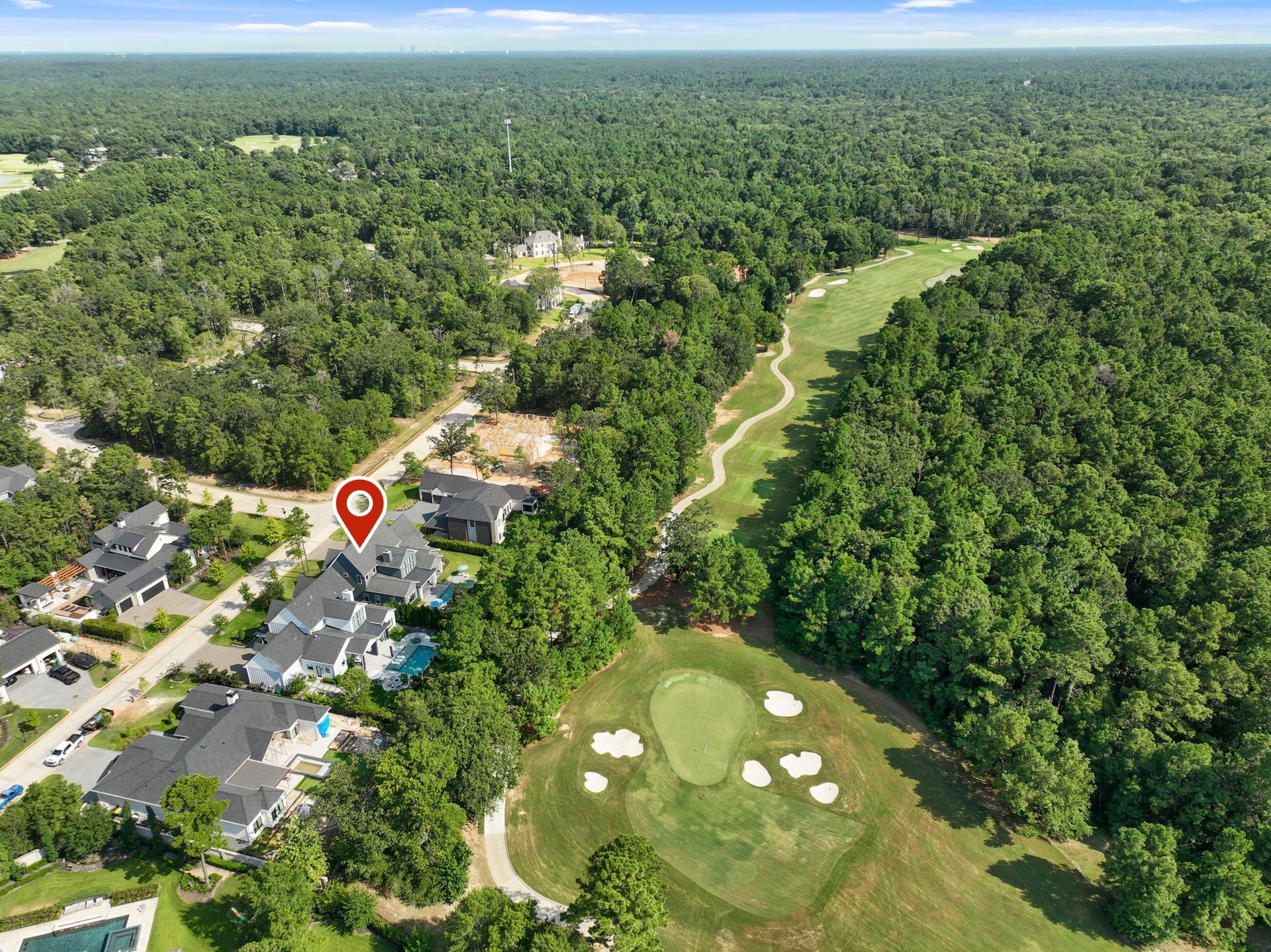 RARE OPPORTUNITY in beautiful Pine Island, Woodforest's exclusive, gated luxury enclave! Stunning custom home backs to the 7th hole of the golf course!