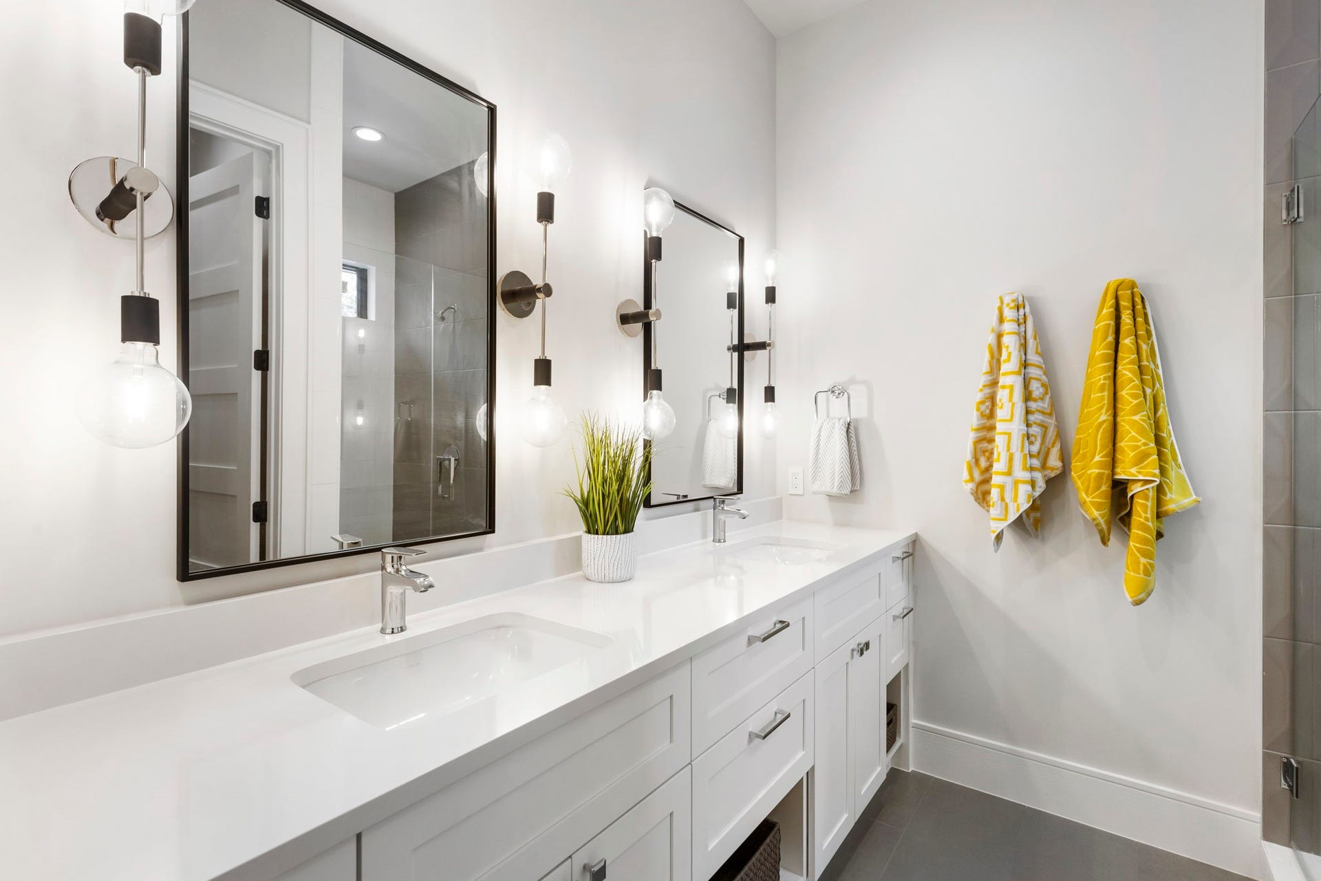 Bedroom 3 en suite bath is ideal for guests with two sinks and added storage.