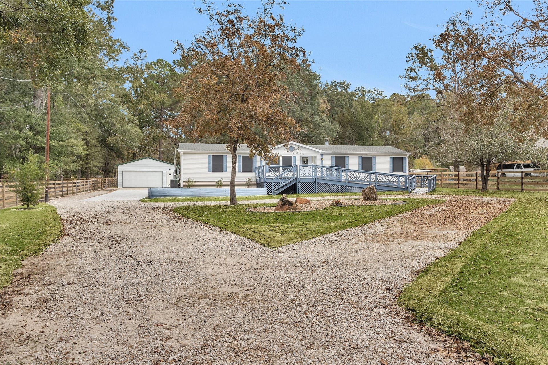 4621 Price Road, Montgomery, TX 77316 Welcome to 4621 Price Rd! Unrestricted land, a new garage and circle driveway with easy to maintain landscaping!