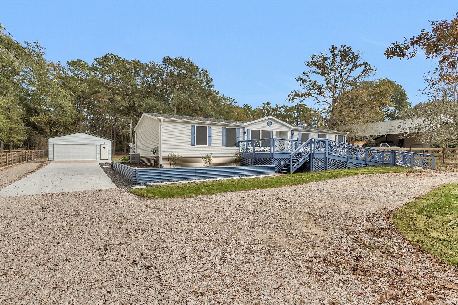 4621 Price Road, Montgomery, TX 77316 Garden beds surround the home, ready for your personal touch