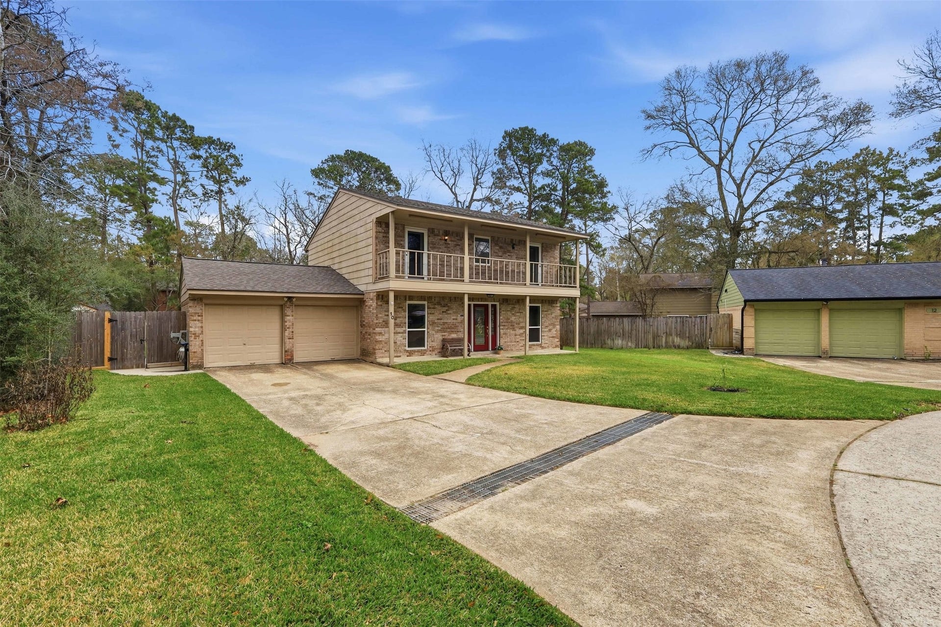 10 E Broken Oak Court, Spring, TX 77381 Spacious driveway and two car garage. Plenty of space for the whole family.