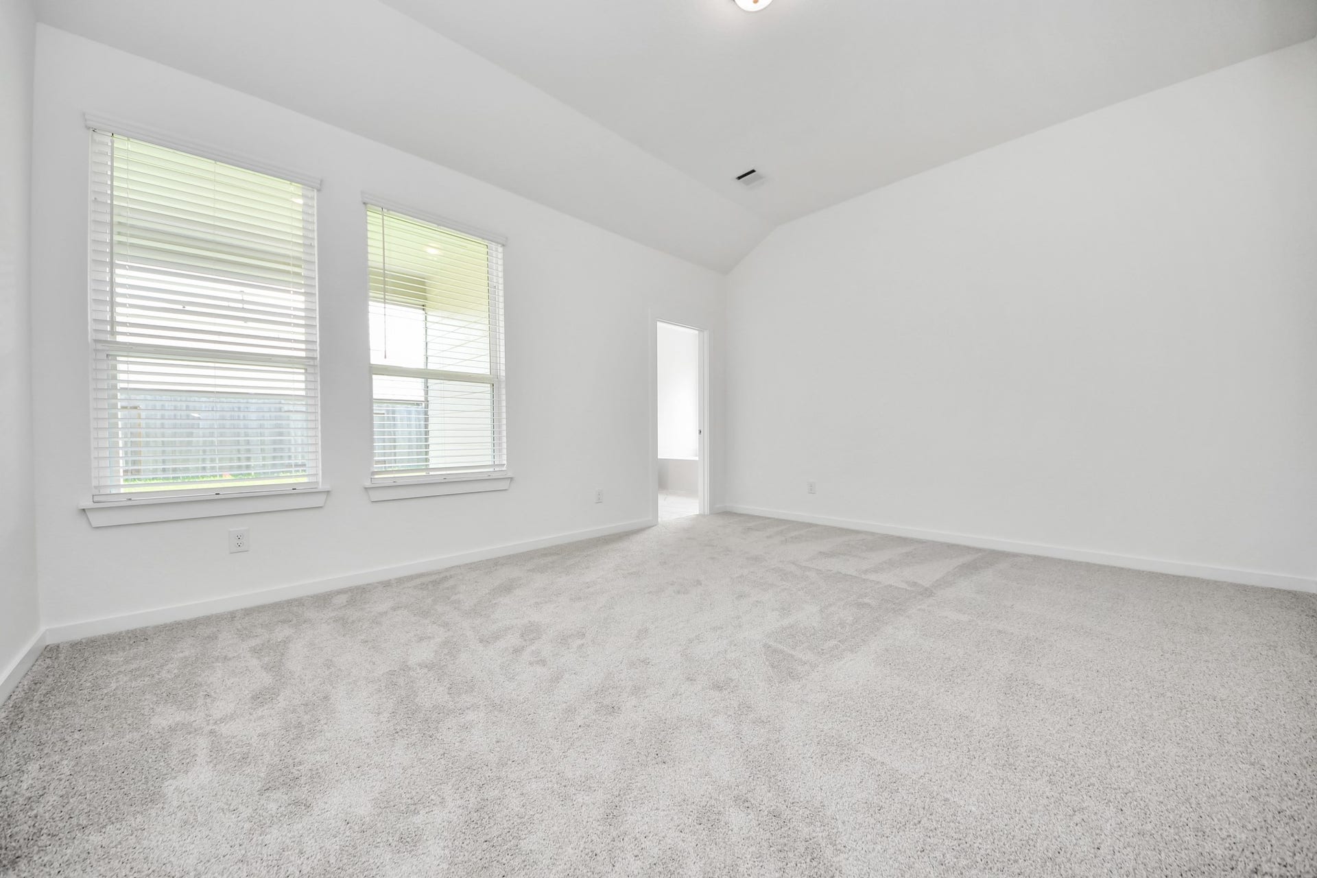 19046 Cape Capasso Drive, Hockley, TX 77447 Another perspective unveils a comprehensive view of the serenity and comfort this primary suite offers. Sample photo of completed home with similar floor plan. Actual colors and selections may vary.