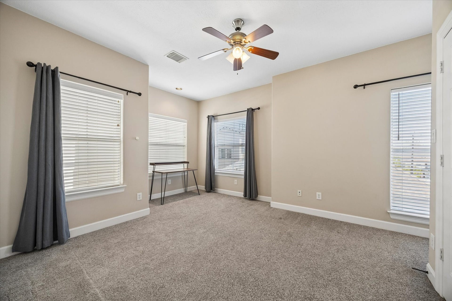 5111 Inker Street, #C, Houston, TX 77007 Secondary bedroom on the third floor with plenty of windows and en suite bathroom .