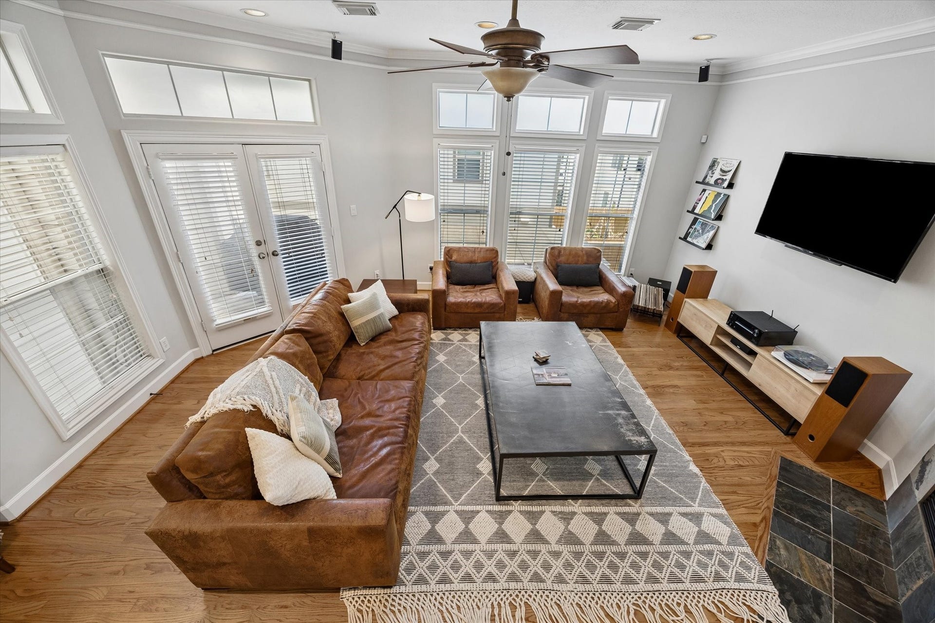 5111 Inker Street, #C, Houston, TX 77007 The second floor living spaces boast wood floors with a large living room. French doors lead to a covered balcony with a direct gas line grill for your convenience.
