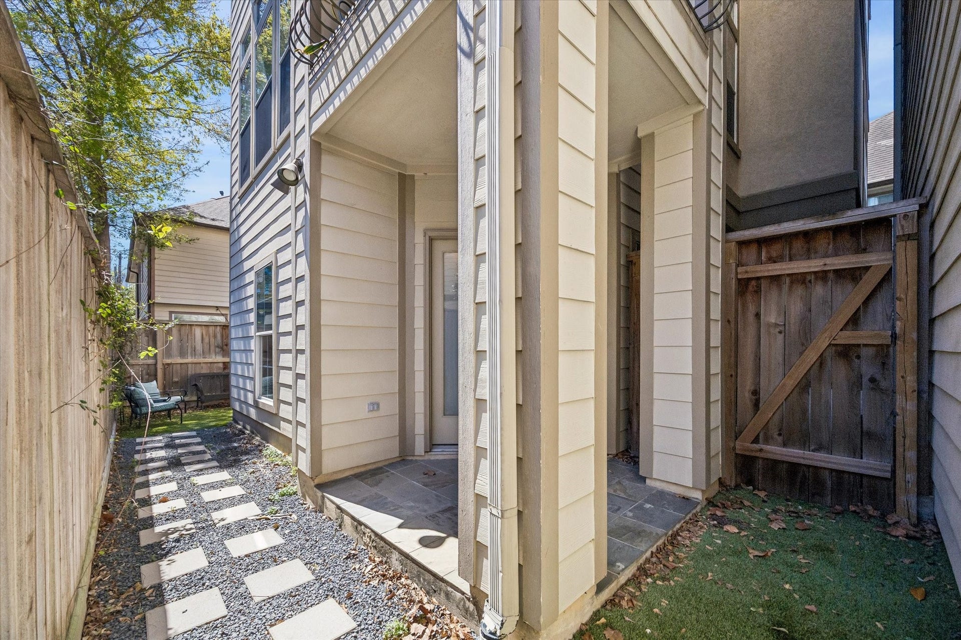 5111 Inker Street, #C, Houston, TX 77007 Covered patio just outside of the first floor bedroom/office. Stepping stones lead to a turfed backyard.