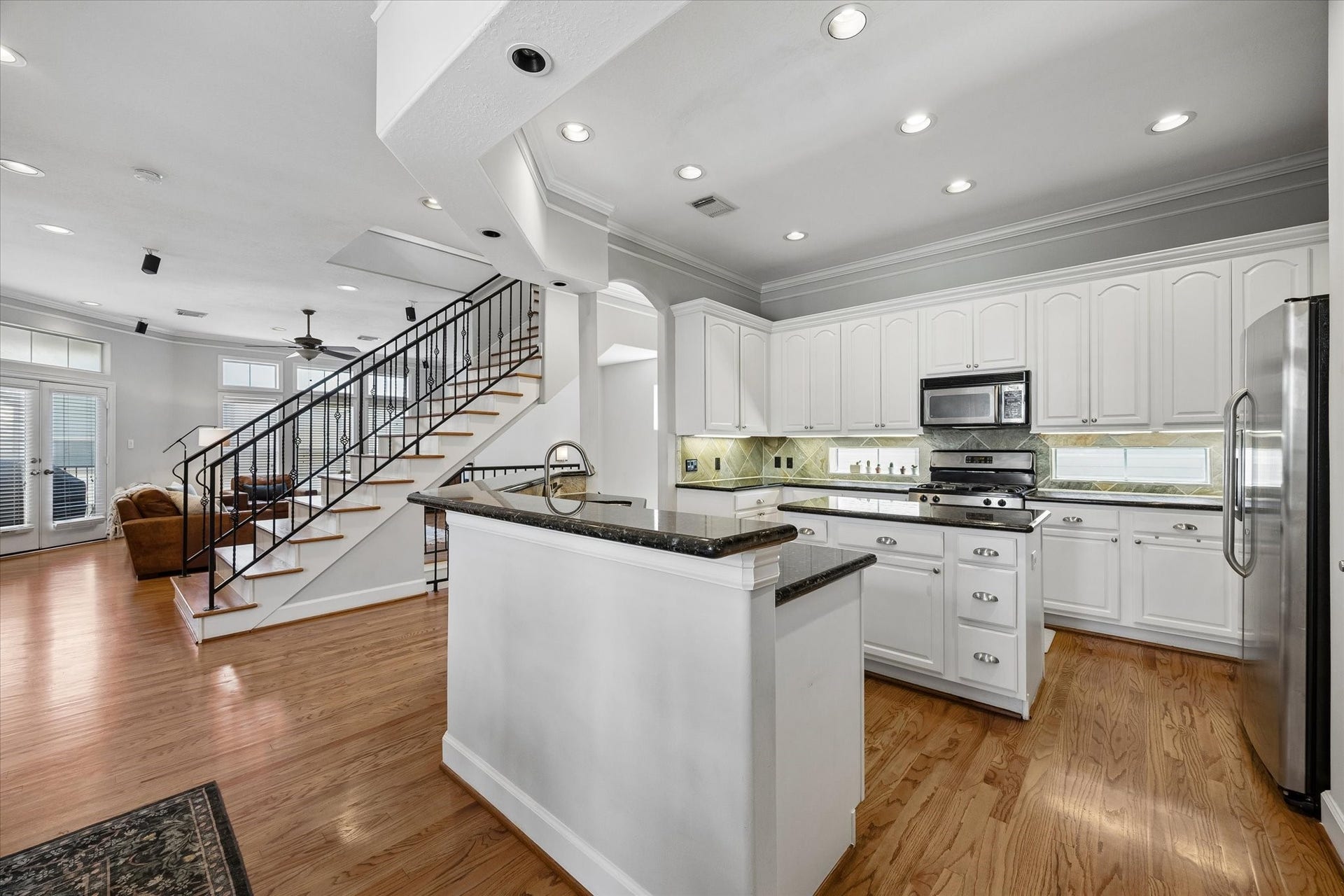 5111 Inker Street, #C, Houston, TX 77007 Open floor plan with island kitchen and plenty of cabinets and pantry. All appliances stay with the property.