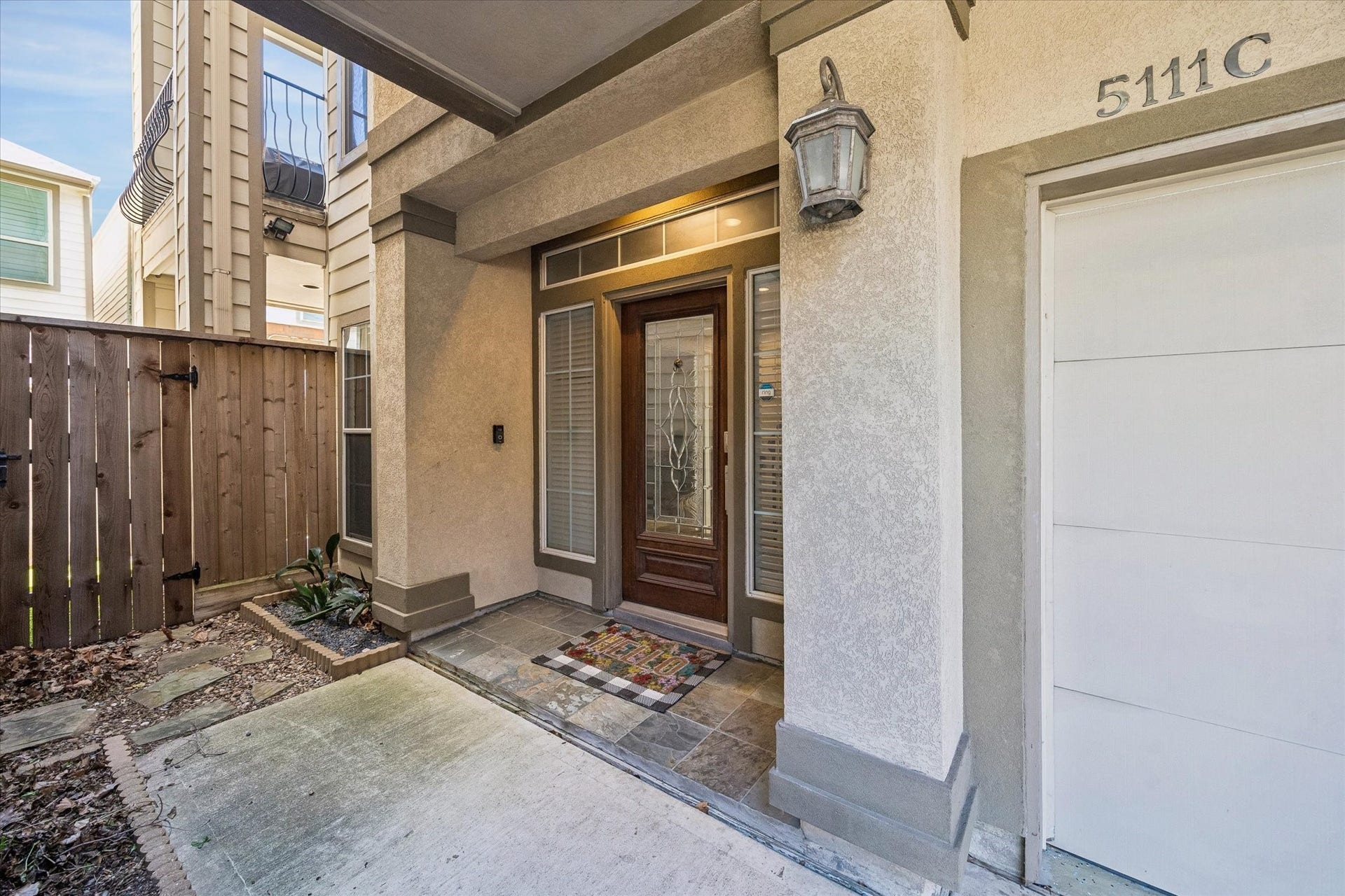 5111 Inker Street, #C, Houston, TX 77007 Welcome to your private front entry. Wood and lead glass front door. Stucco repairs completed in 2026.