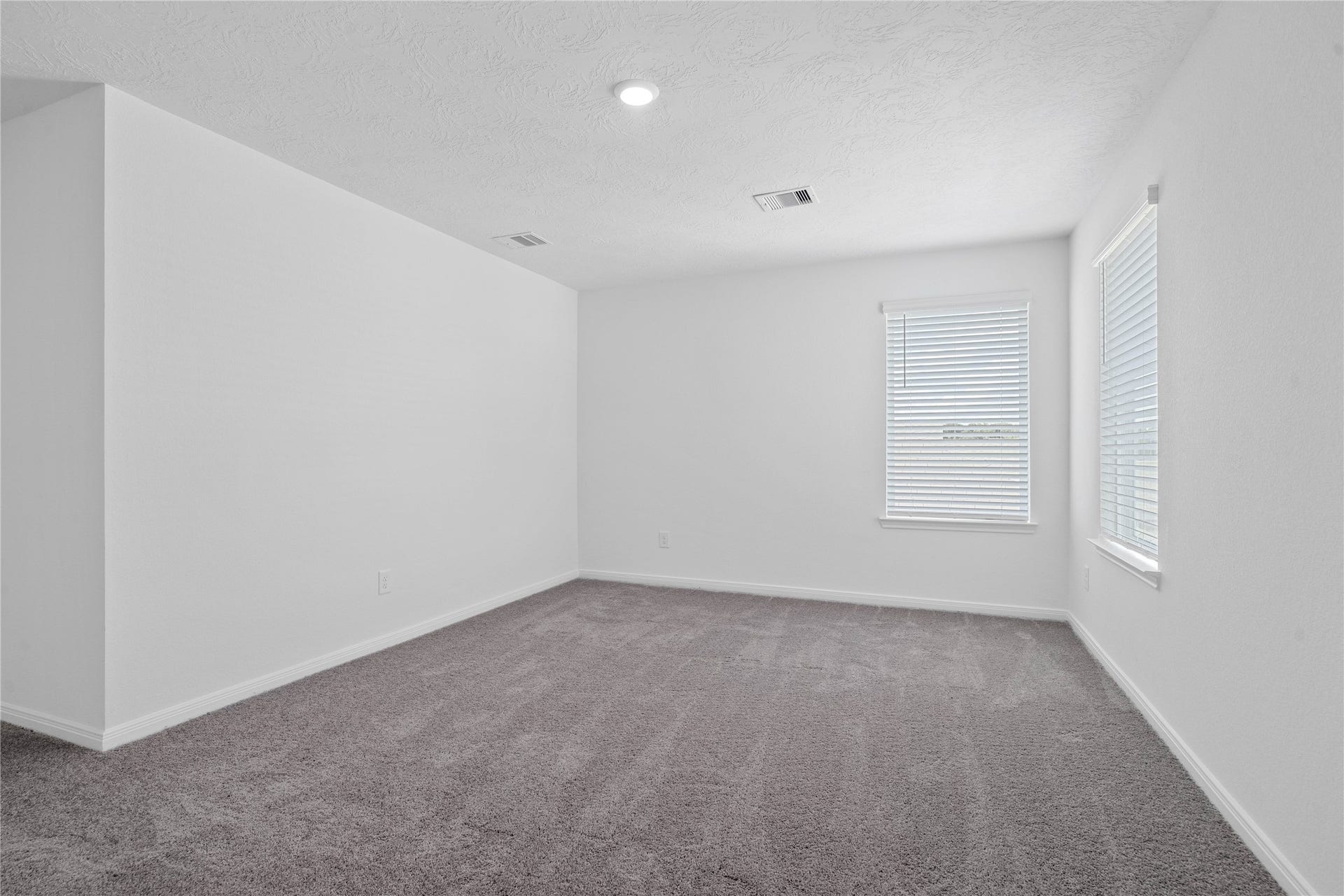 10160 Maple Cove Lane, Willis, TX 77378 Upstairs, enjoy the Loftan additional living area perfect for a game room, media space, or a peaceful retreat.