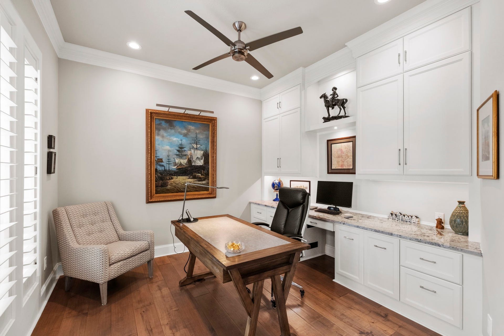 7 Silverloch Court, Sugar Land, TX 77479 Chic home office with elegant built-in cabinetry, special hidden features in cabinets, all complemented by warm hardwood floors.